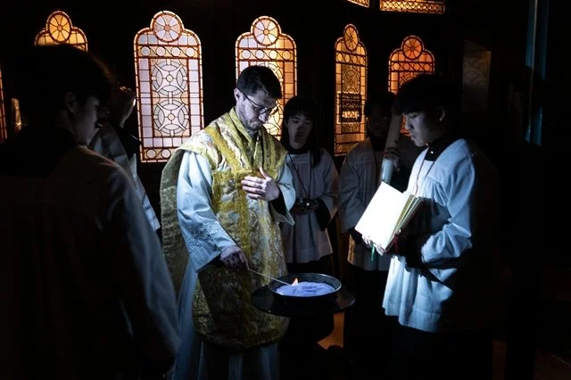 Fr Phil lights the fire