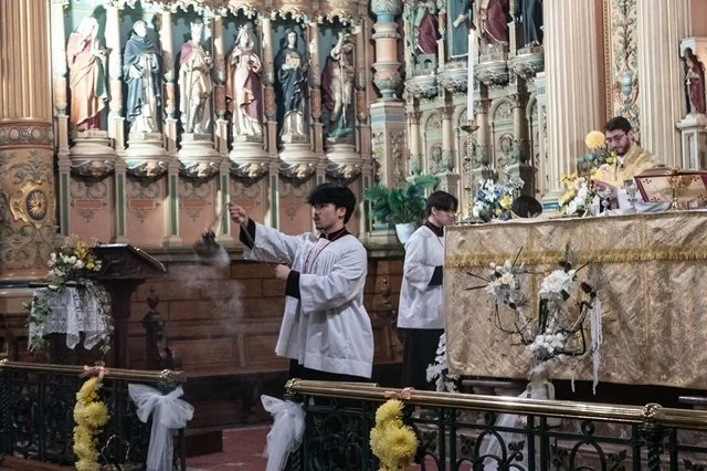 Congregation blessed with incense.