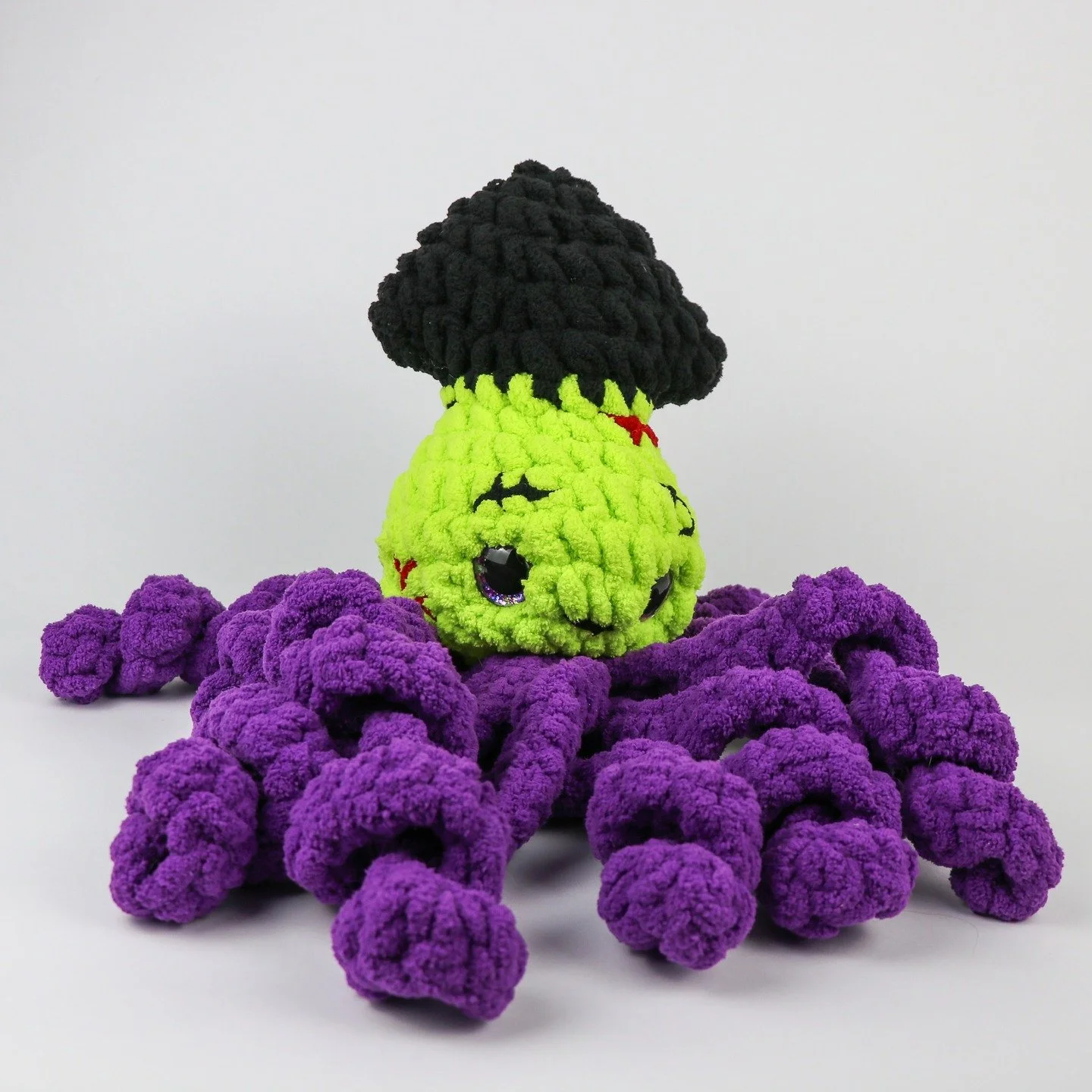 Introducing the Franken-Squid!!! ⚡️💜💚

Stitched together with love, lightning, and a little bit of chaos, this cryptid is surprisingly cuddly for something build in a lab. Perfect for monster mashers, Halloween maximalists, neurodivergent stim grem