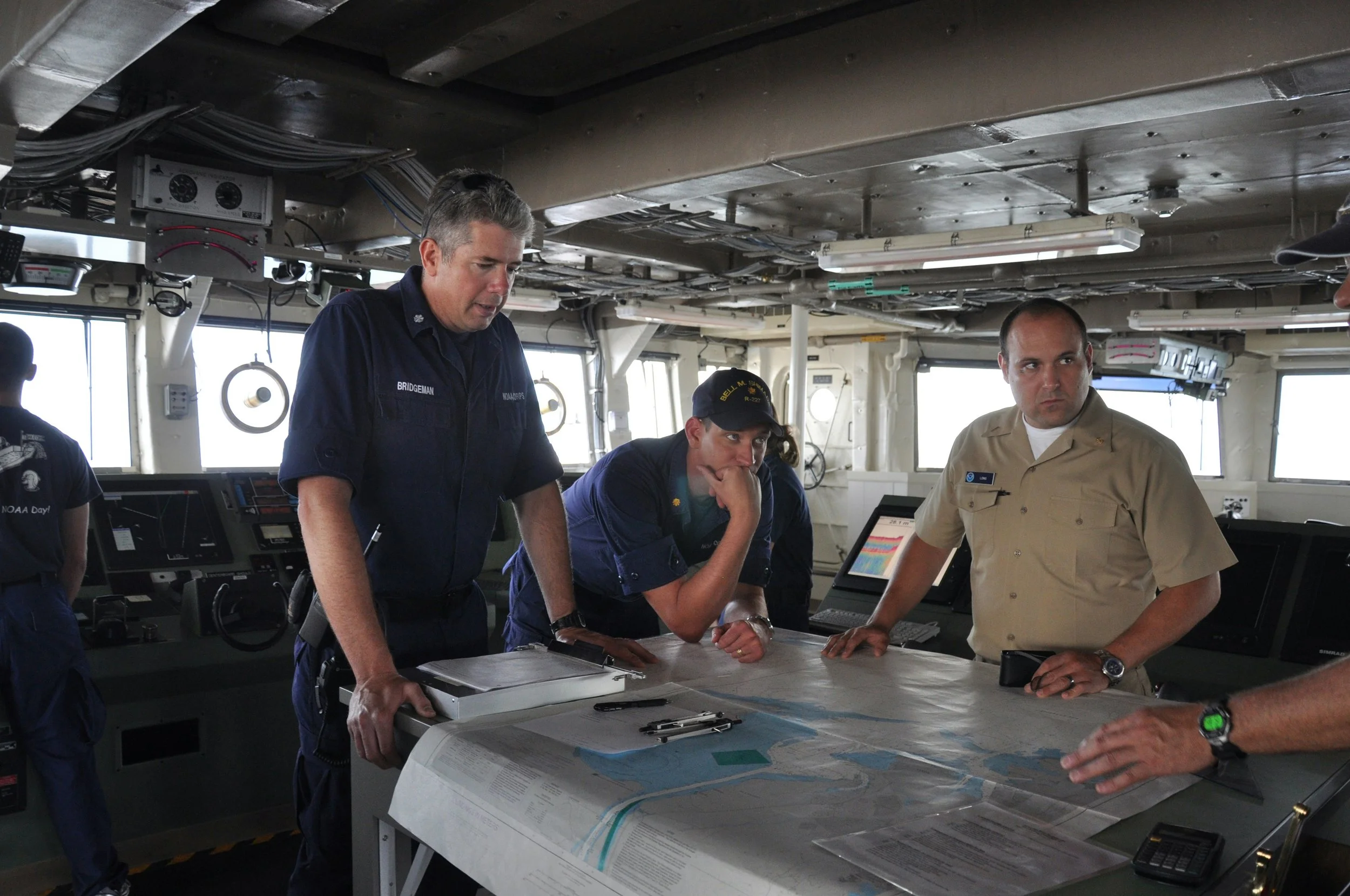 Marine professionals conducting active project intervention and assessment aboard a vessel during local sea trials.