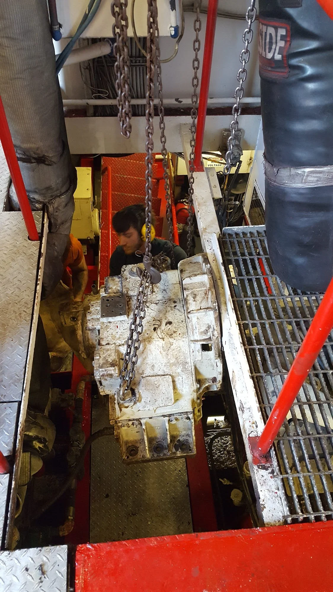 Marine gear removal from machinery space during commercial vessel refit — owner-side project oversight and change order management by KEY Marine Advisors