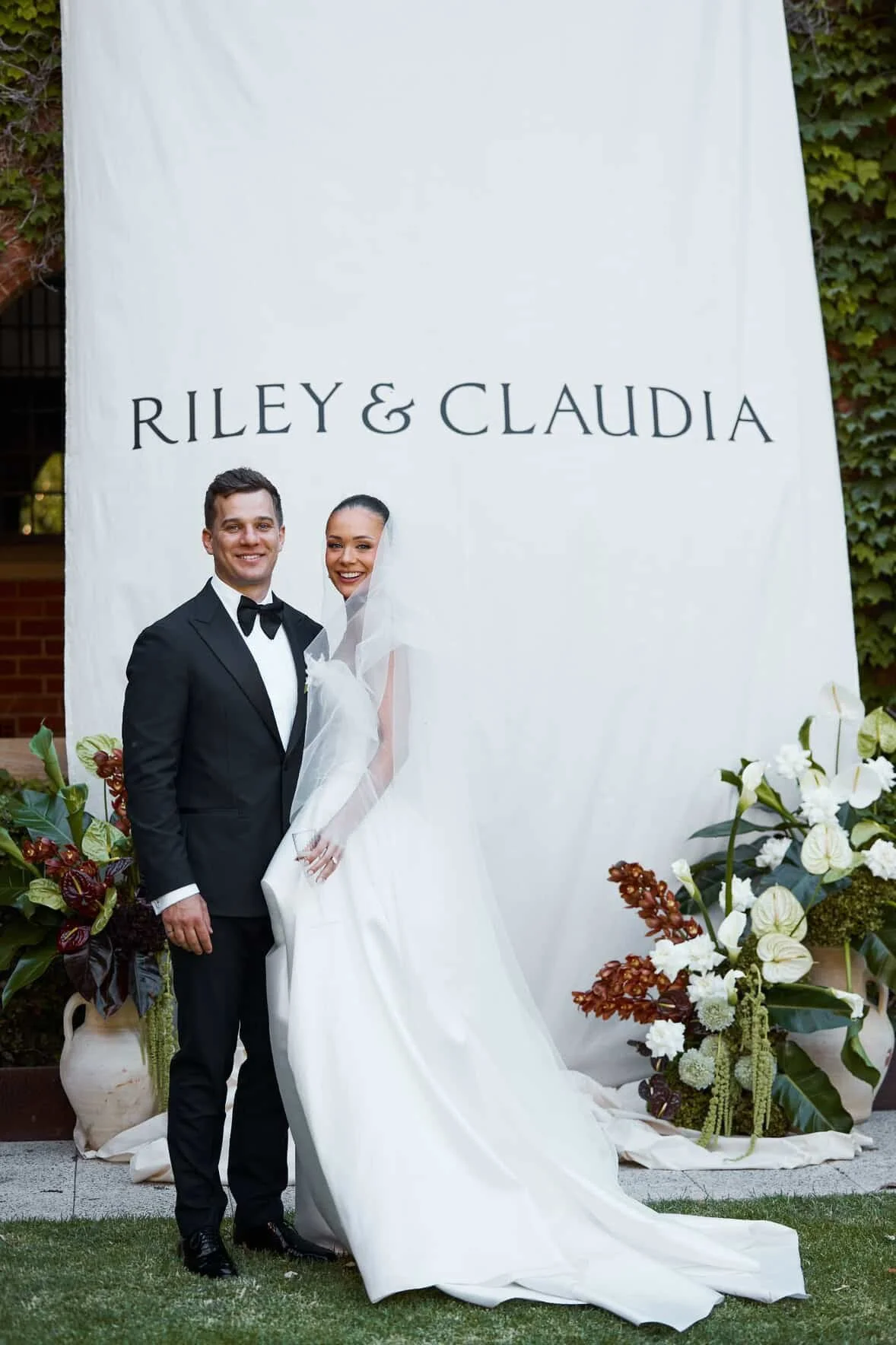 couple with linen sign 44E6F968-6D6B-4C90-87C4-0B8FA077C75A.JPG