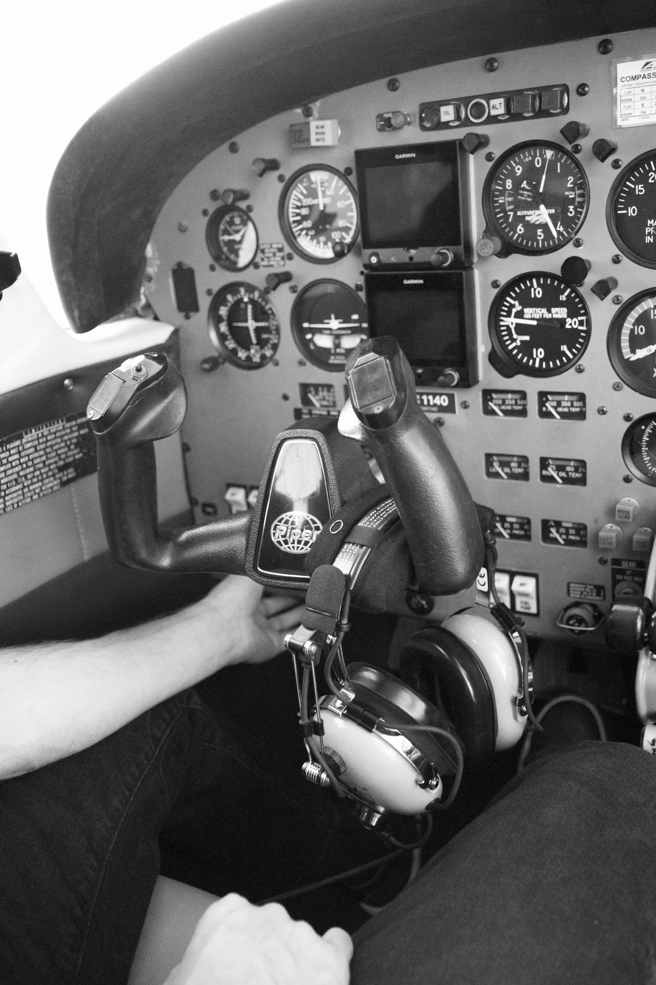 Flight instructor instructing in an airplane at a flight school.