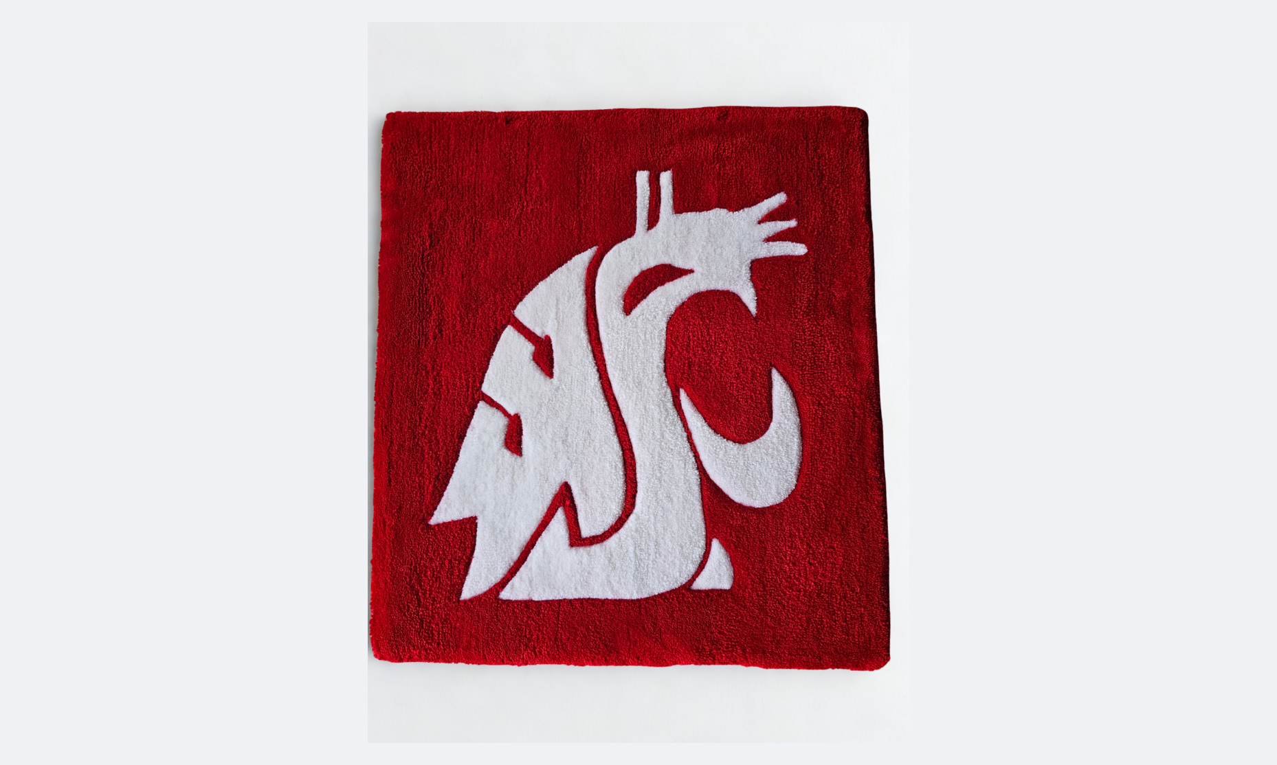 Red doormat with a white Washington State University logo featuring a stylized cougar head