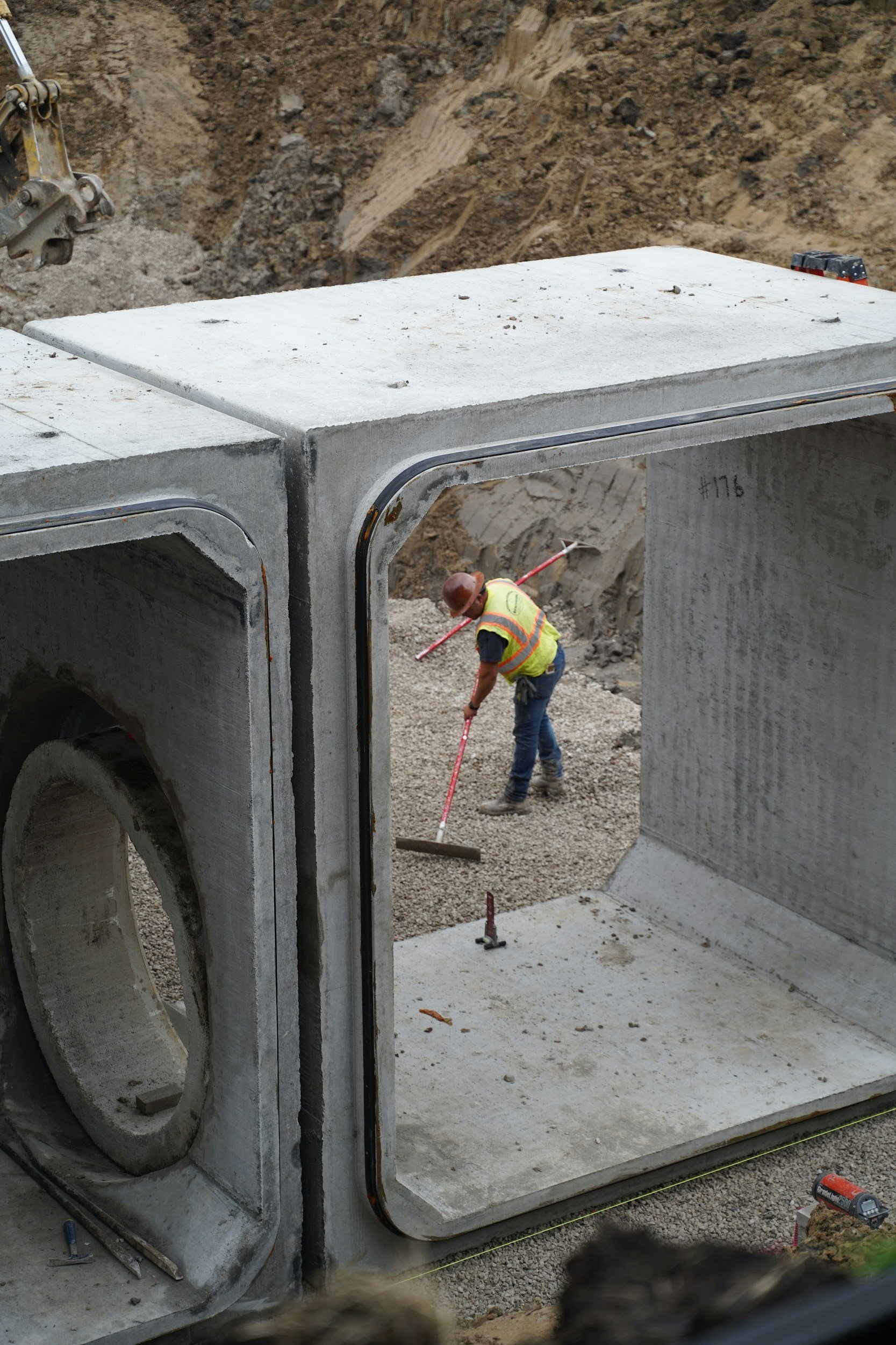civil construction worker clearing ground