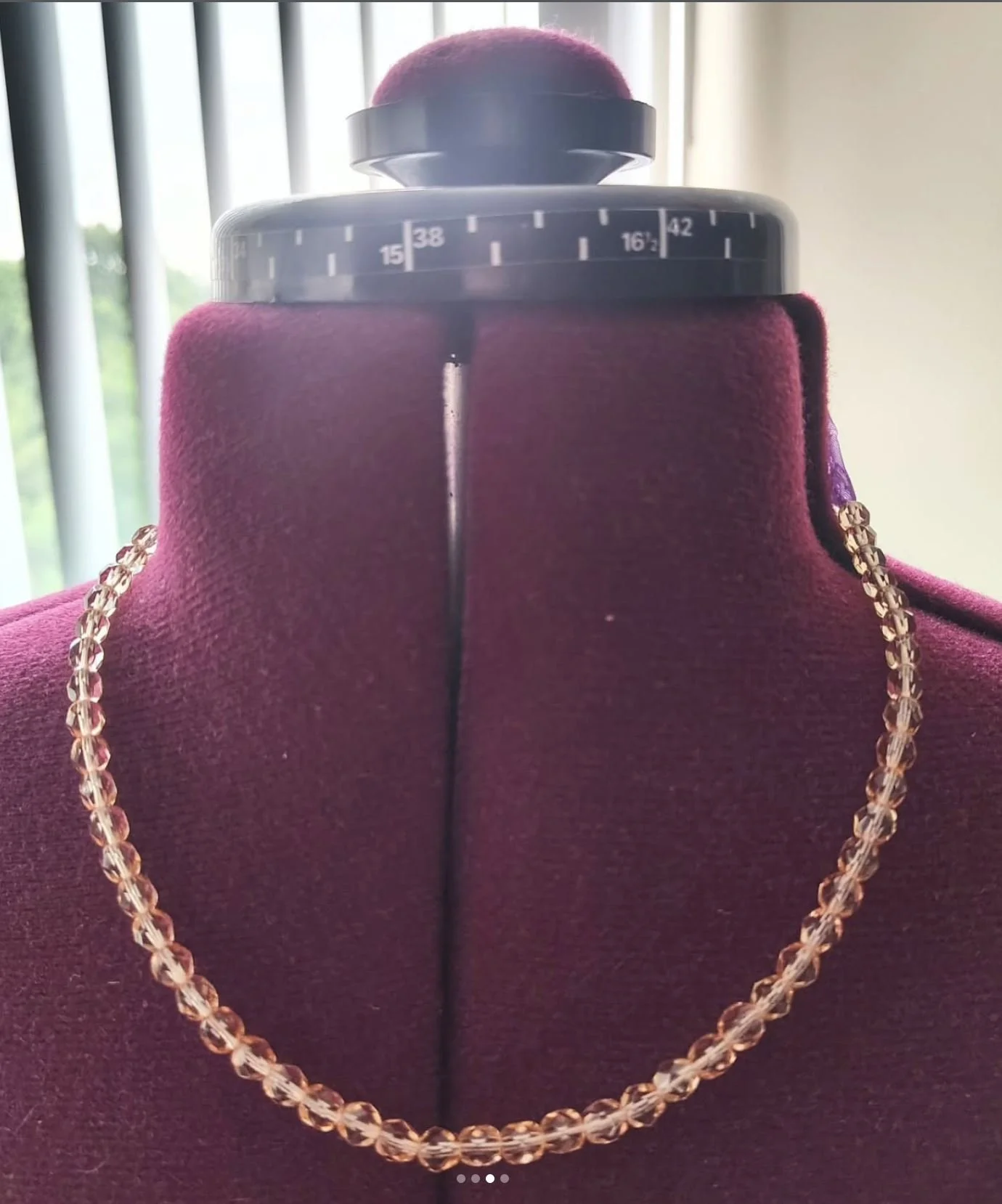 Pink necklace on mannequin.JPG