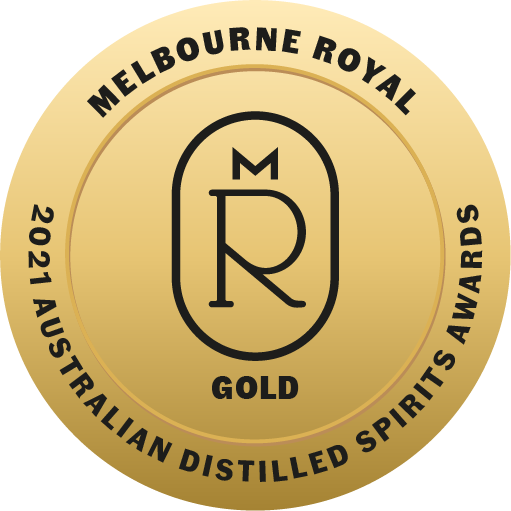 Gold medal with black text and logo, reading 'Melbourne Royal 2021 Australian Distilled Spirits Awards'. The logo features a circle with 'M R' and a line through them, and the bottom says 'GOLD'.