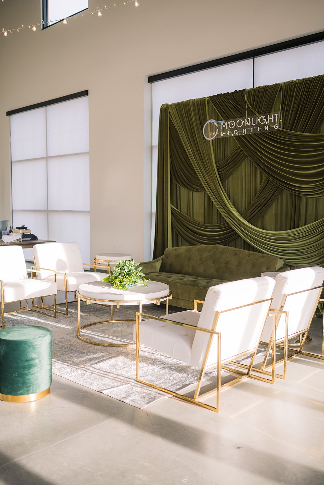 Another elegant look in our Enchanted hall with a green backdrop and modern seating