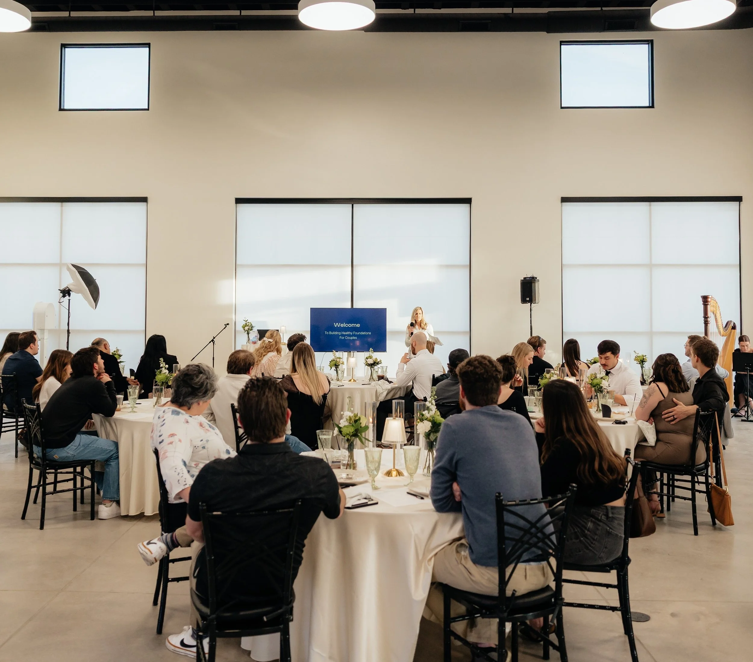 Guests viewing a presentation at a corporate event in Herriman