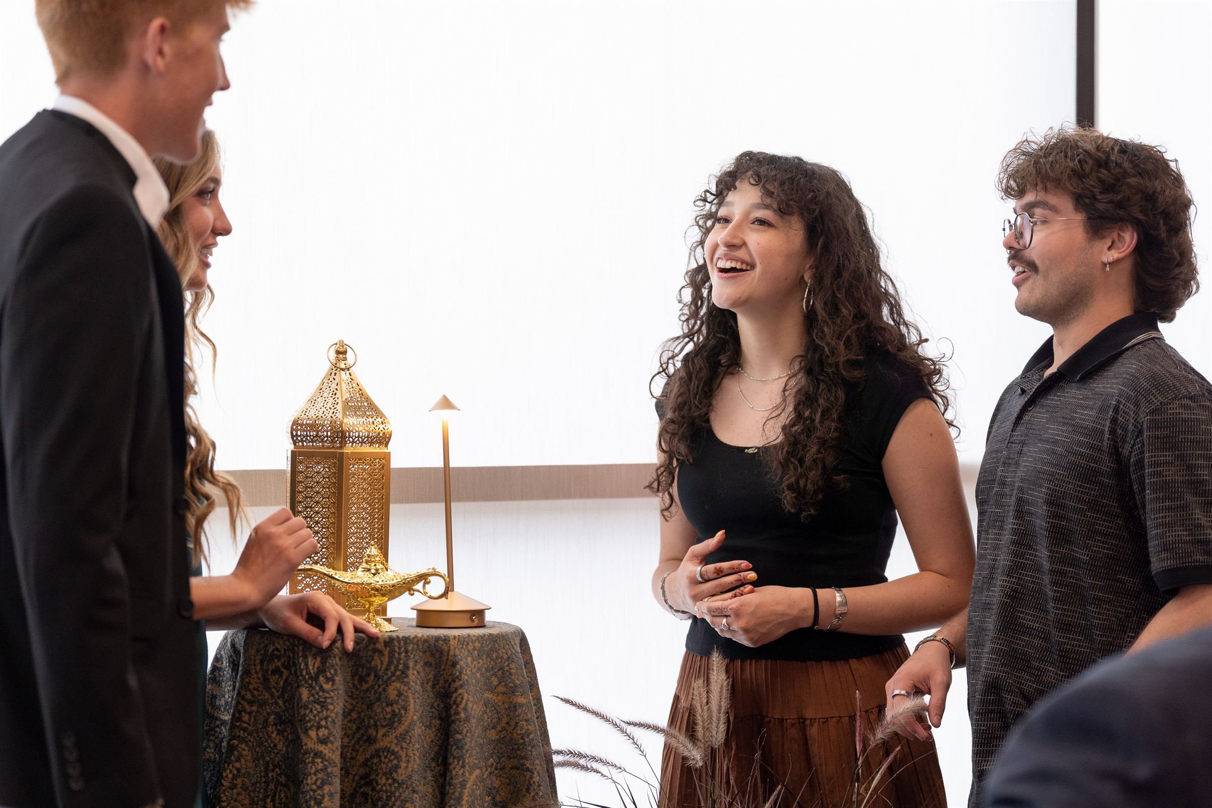 Guests mingle at an Eastern Indian style gathering in Herriman