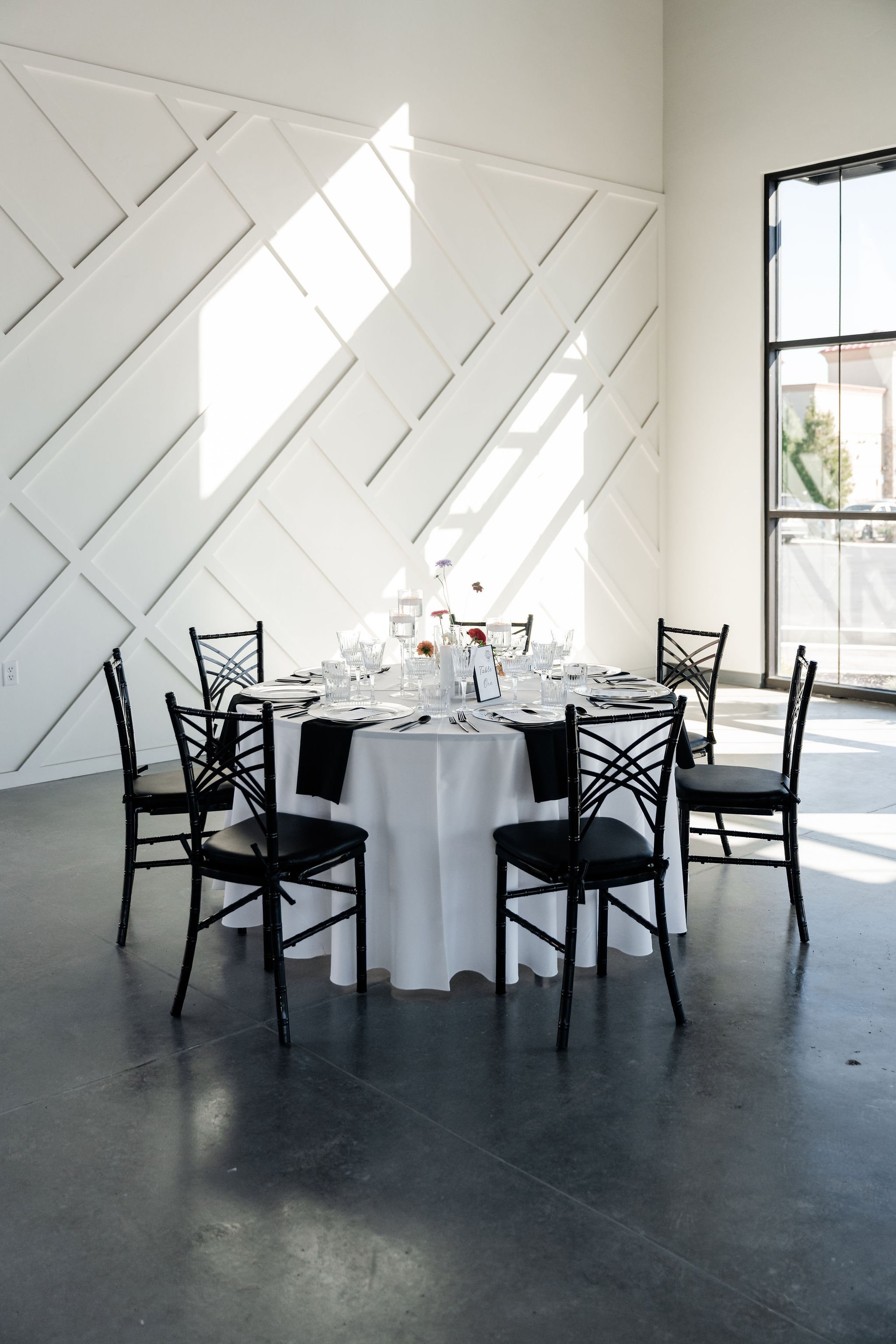 Elegant round table dining setup in our Enchanted Hall