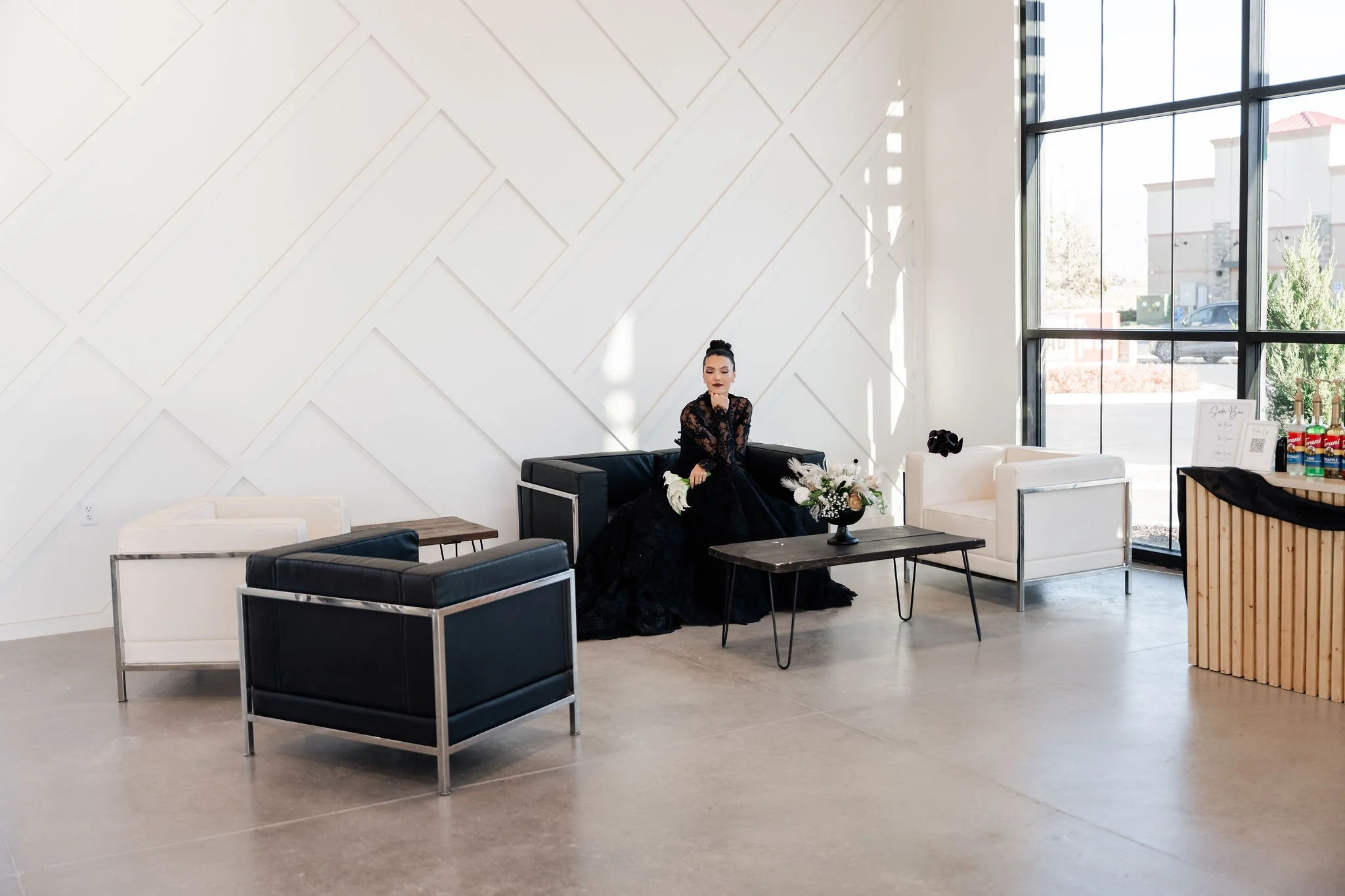 Modern seating in front of our sleek wainscoting wall