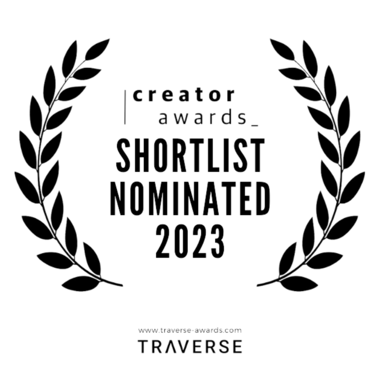 Black and white graphic with a laurel wreath surrounding the text 'Creator Awards Shortlist Nominated 2023' and the website 'www.traverseawards.com' at the bottom.