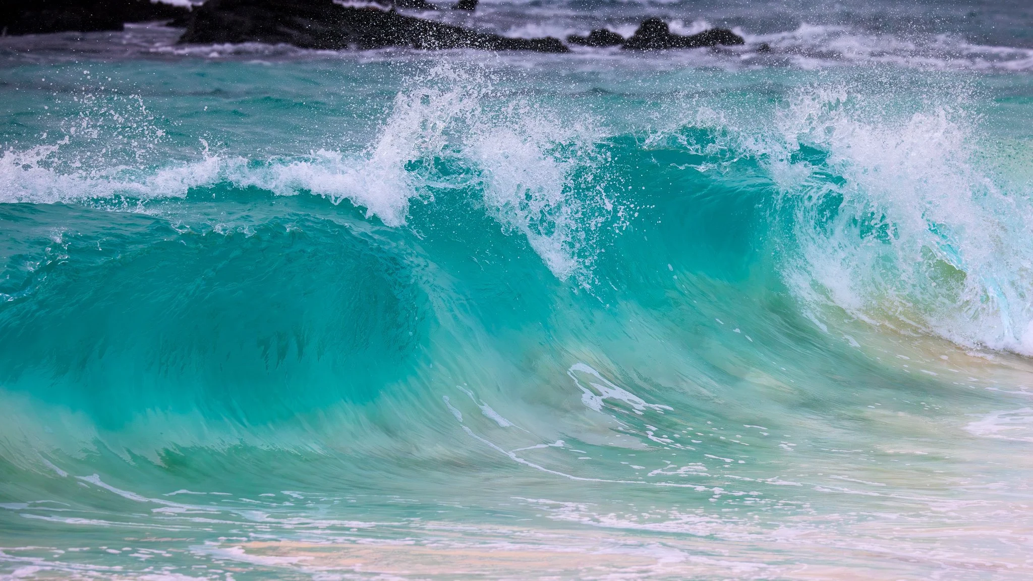 Waves crashing on Cerro Brujo Beach, San Cristóbal Island