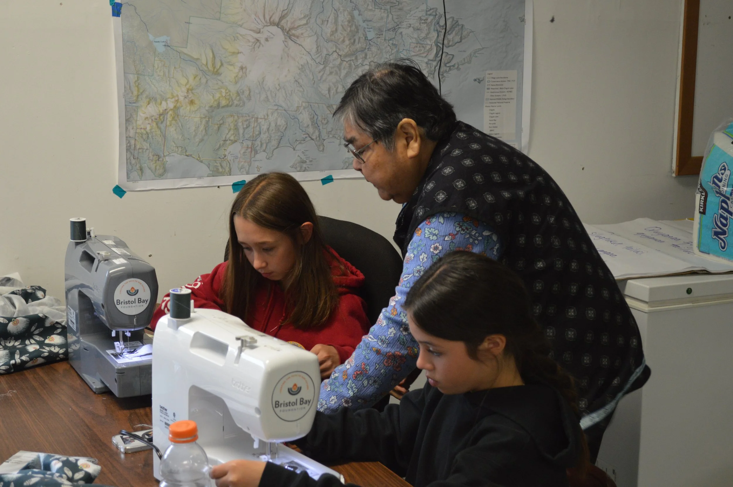 Lena Anderson Helping Chignik Bay Campers with Sewing