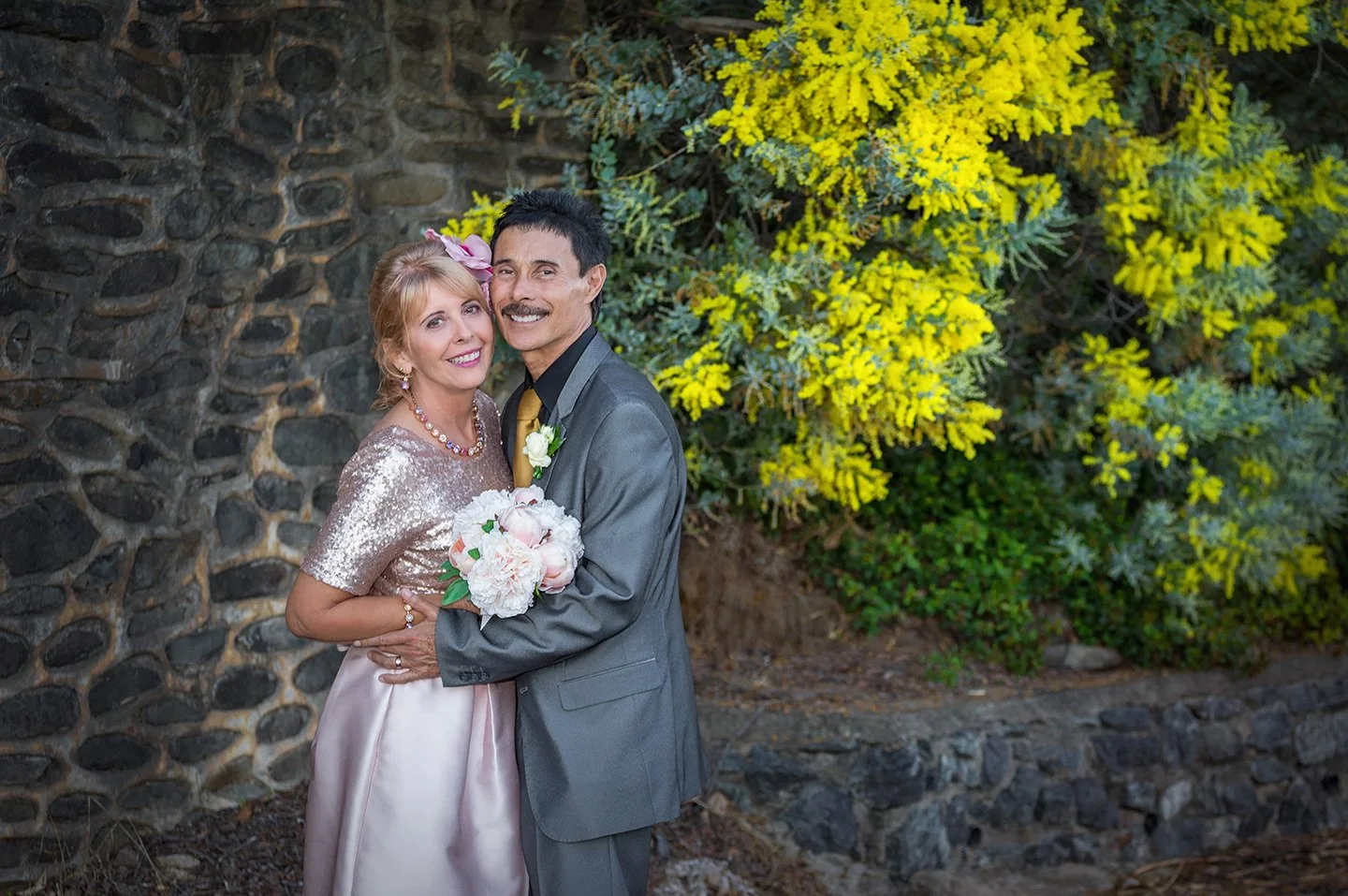 Lesley & David with wattle.jpg