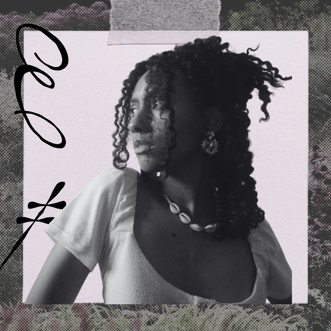 Na imagem temos a figura de Ludmila Henrique. Estudante da Unesp de Bauru, uma jovem negra, de cabelo cacheado, vestindo uma blusa branca. Ela está olhando para a lateral.