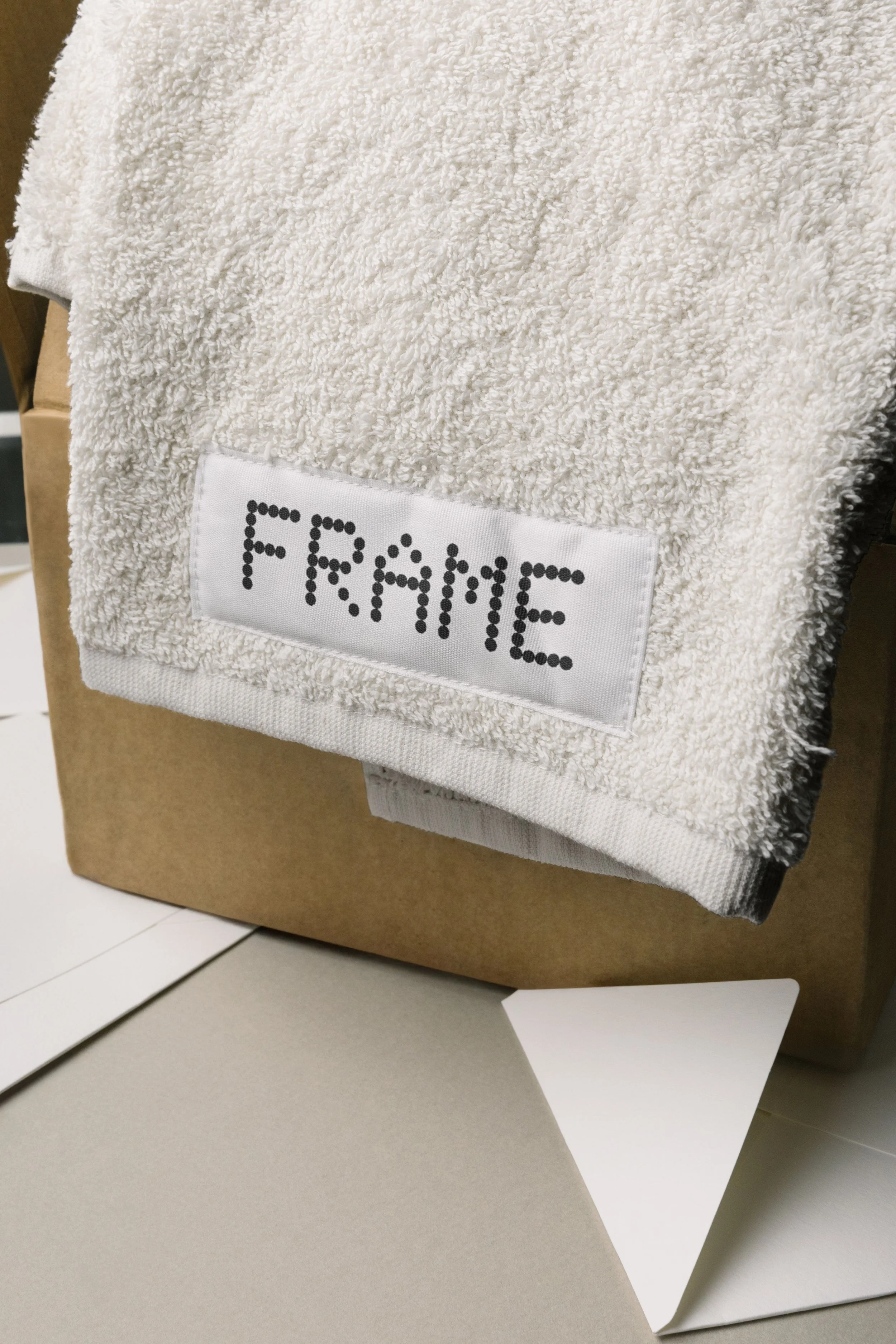 Visual identity and packaging design for Frame Home — Australian home textiles brand by Signet Studio Australia