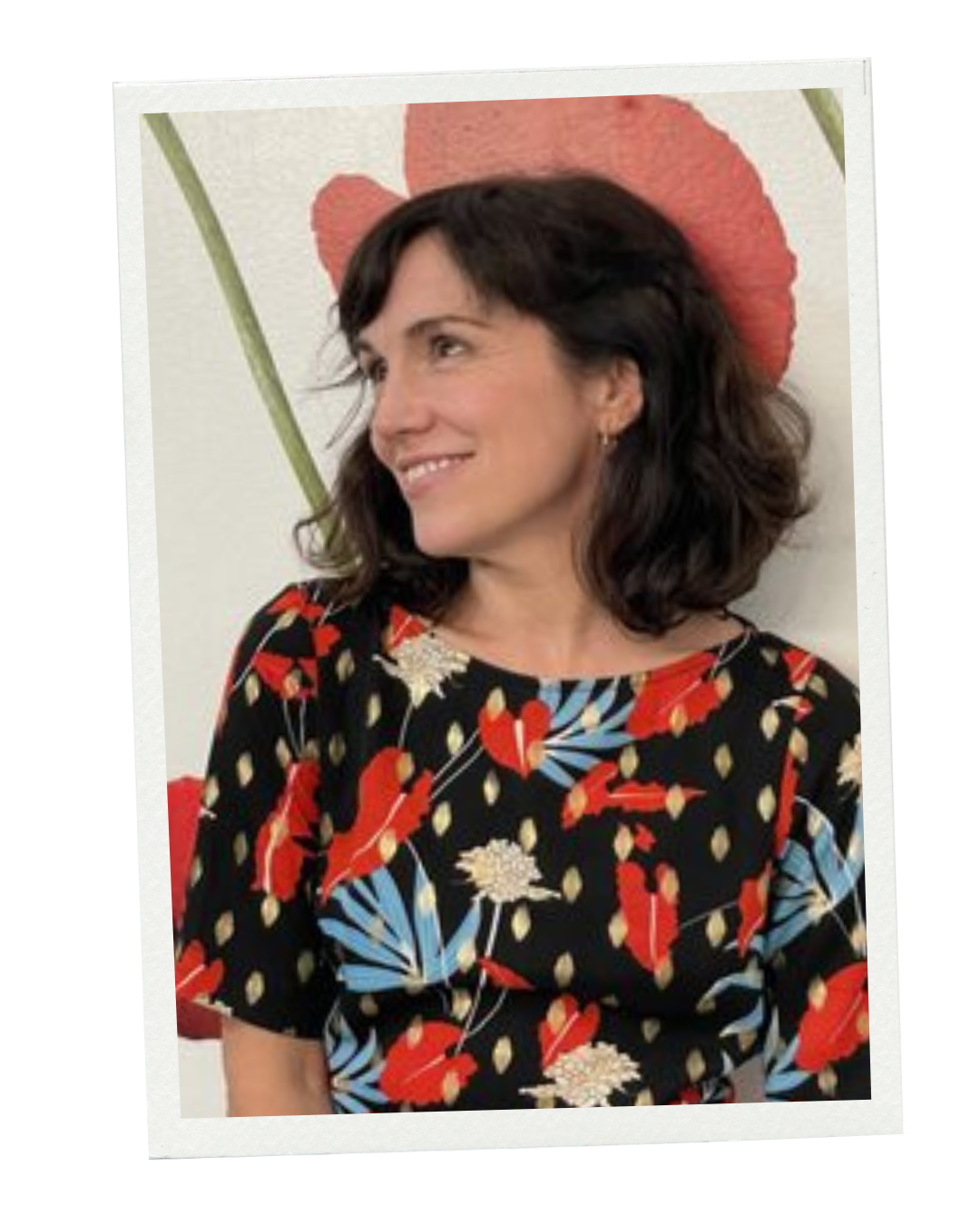 a woman with an elegant mid-length bob and soft curls with side swept bangs