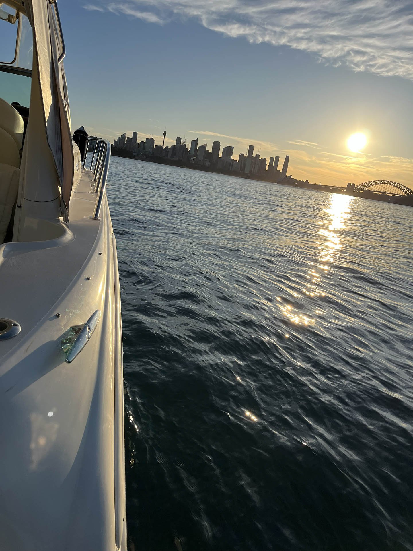 View of a city skyline across the water during sunset, seen from Opal.
