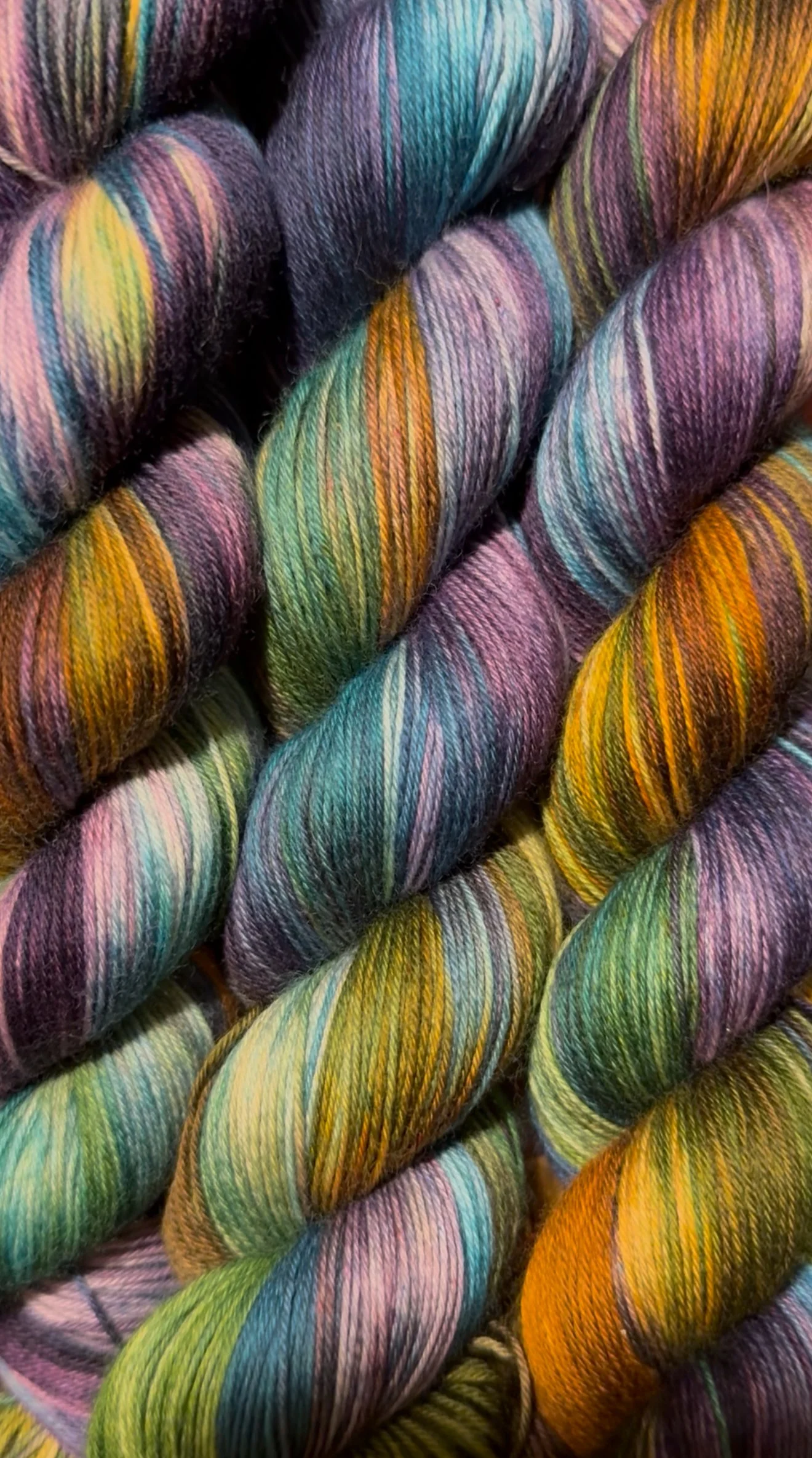 Close-up of multicolored skeins of yarn.