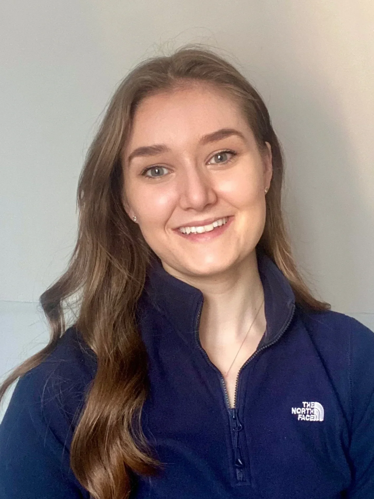 Photo of physiotherapist Chloe Rowlatt in a blue shirt.