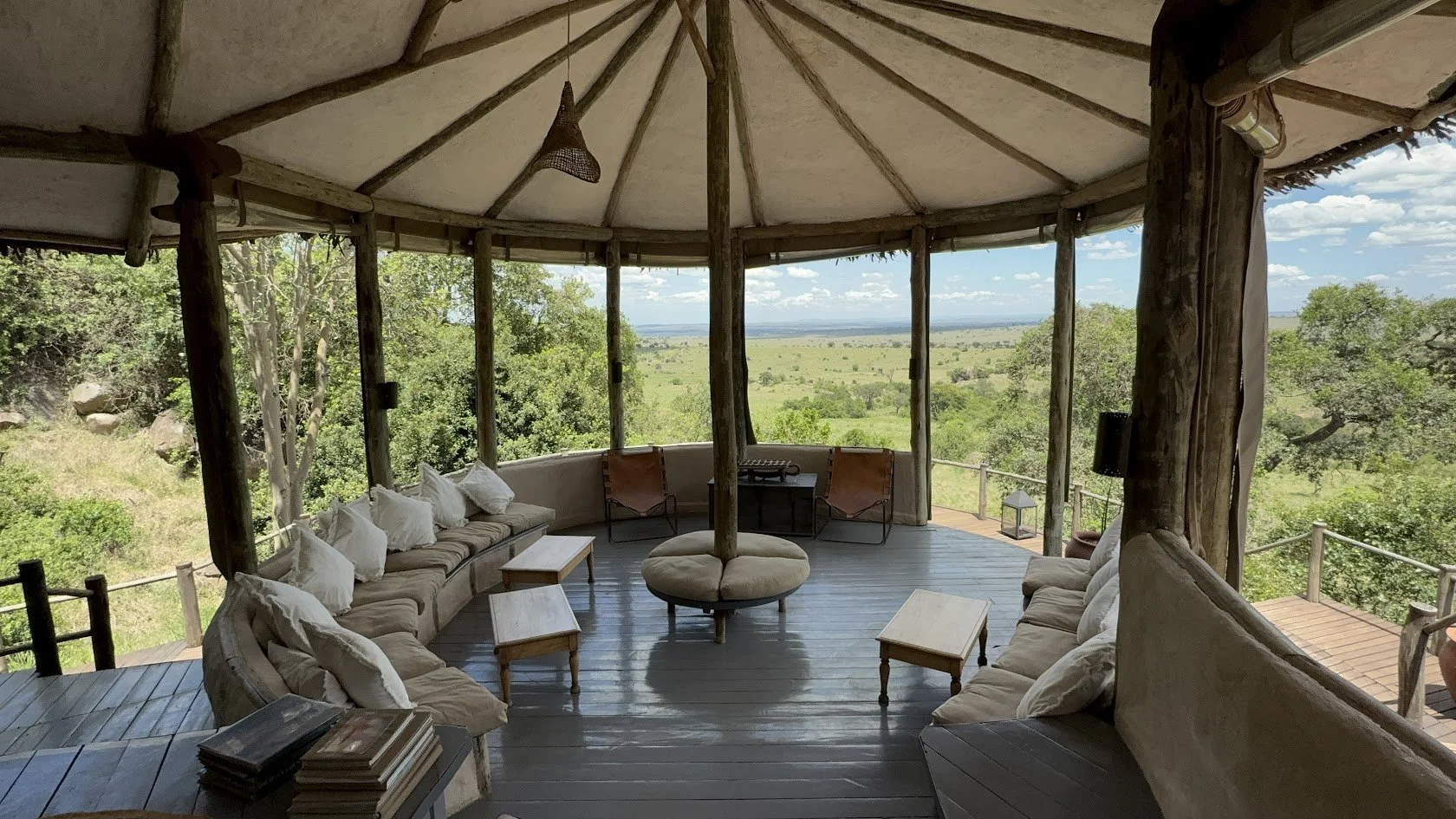 Luxury safari lodge in Africa with private deck overlooking savannah and wildlife