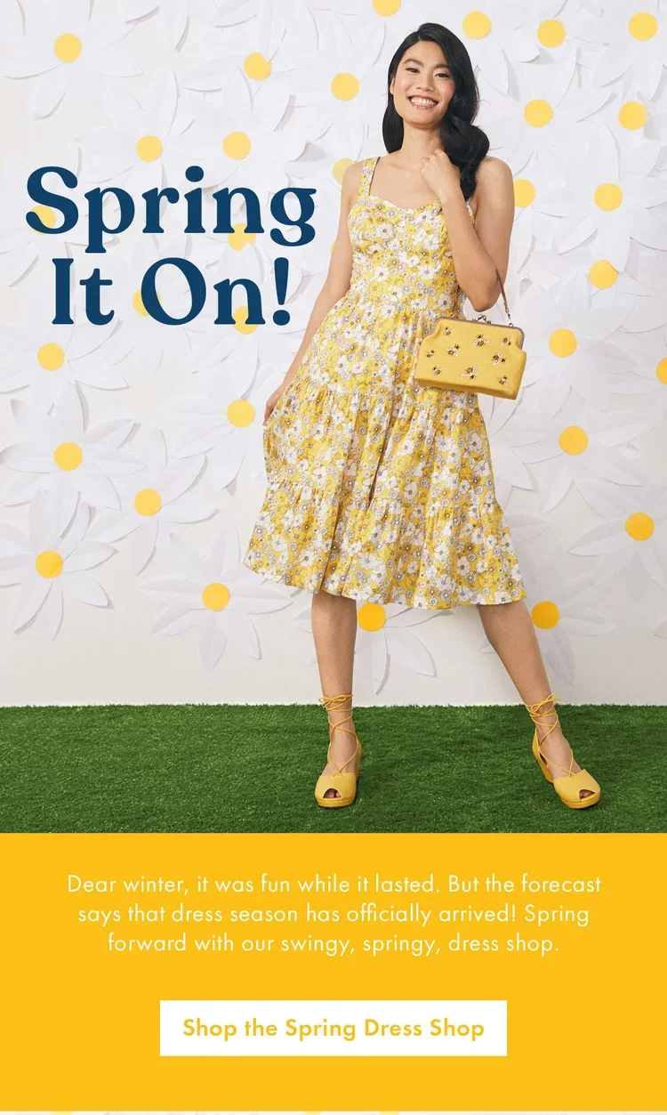 A woman wearing a yellow floral dress, yellow heels, and carrying a yellow handbag, standing in front of a spring-themed background with white flowers and yellow dots, promoting spring dress shopping.