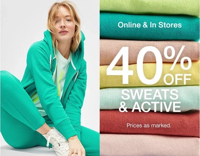 A woman sitting in sporty green activewear next to a stack of folded colorful sweatshirts advertising 40% off on sweats and activewear.