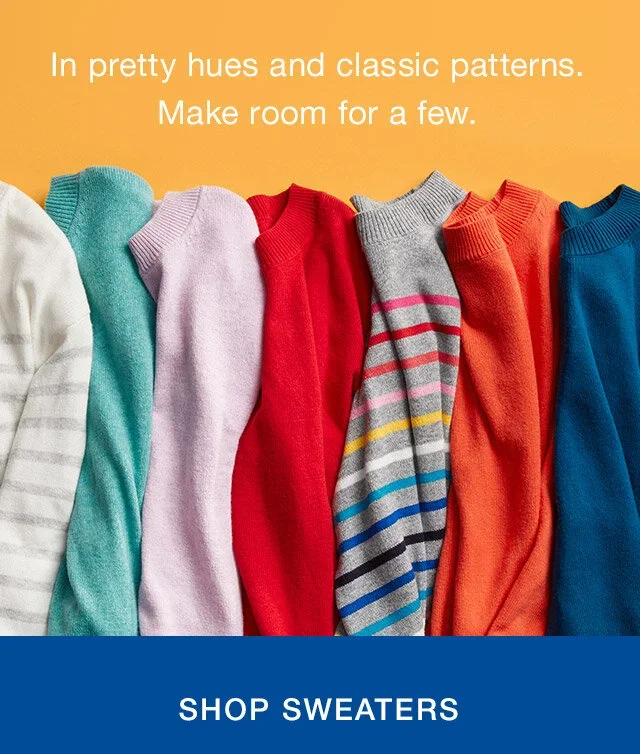 Array of colorful sweaters in hues of white, teal, purple, red, gray with pink stripes, orange, and blue, with text encouraging to shop sweaters.