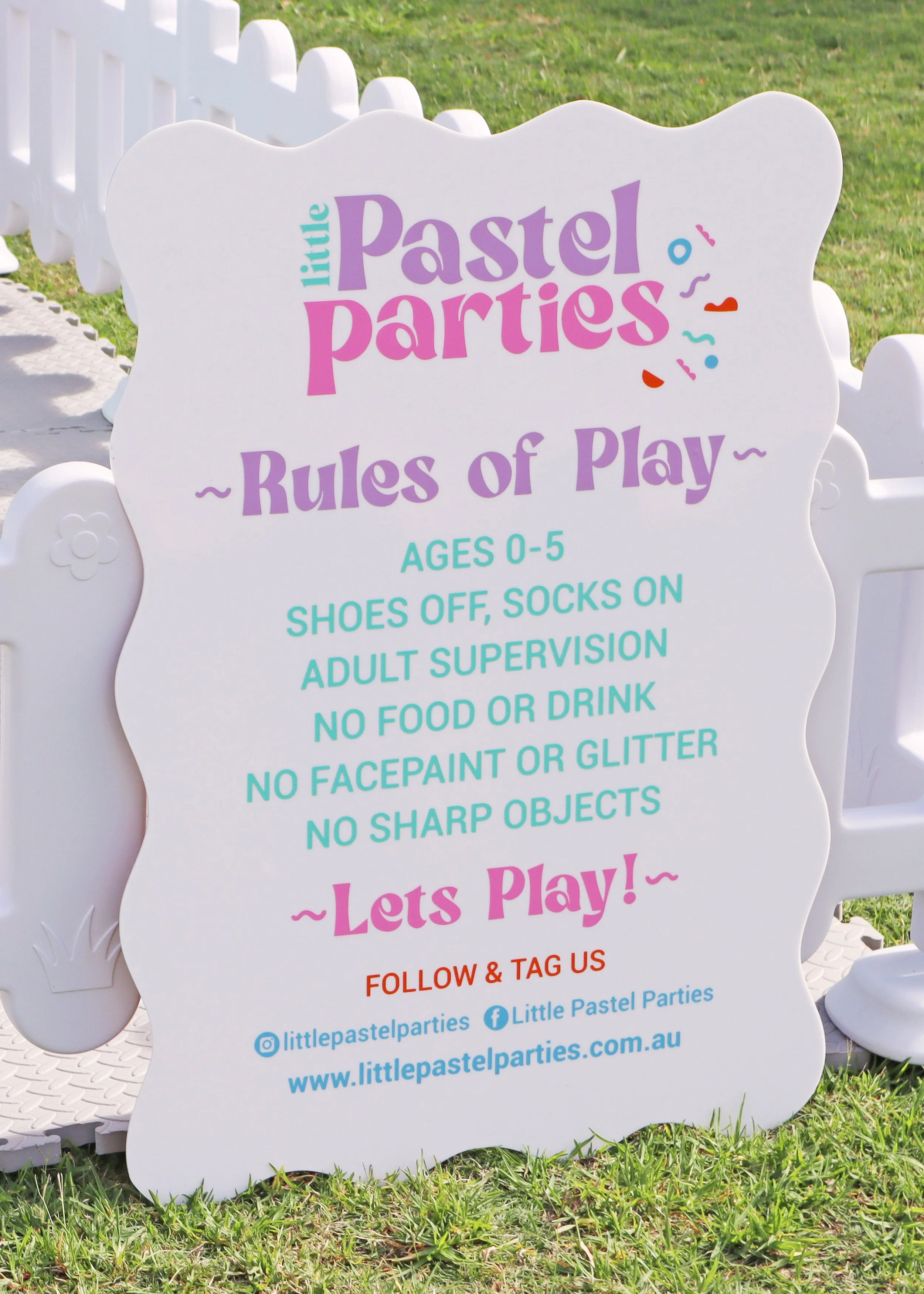 Signboard for Little Pastel Parties with rules for children's play area, including age limit 0-5, shoes off, socks on, adult supervision, no food or drink, no face paint or glitter, no sharp objects, and a call to follow and tag on social media.