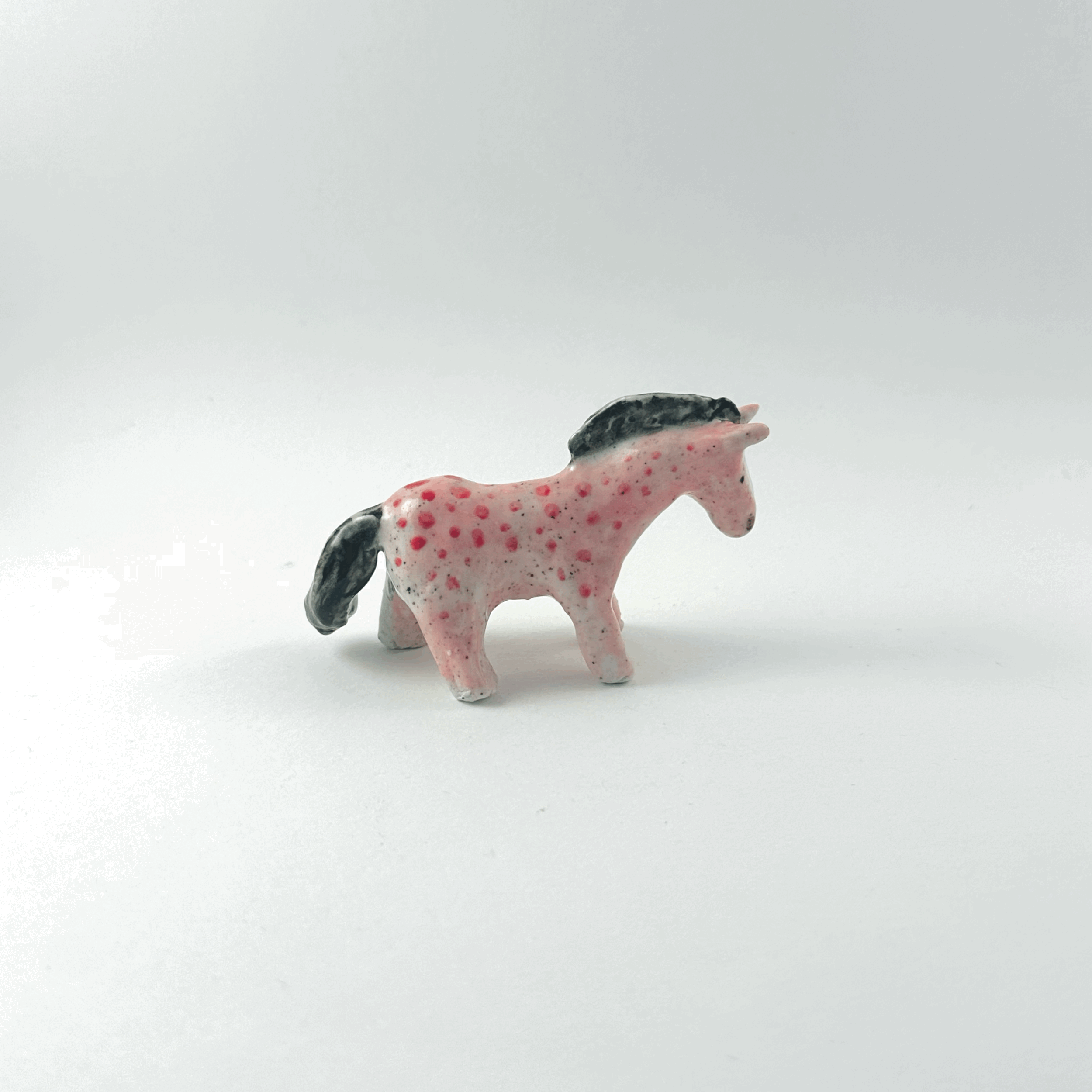 Pink horse with red spots