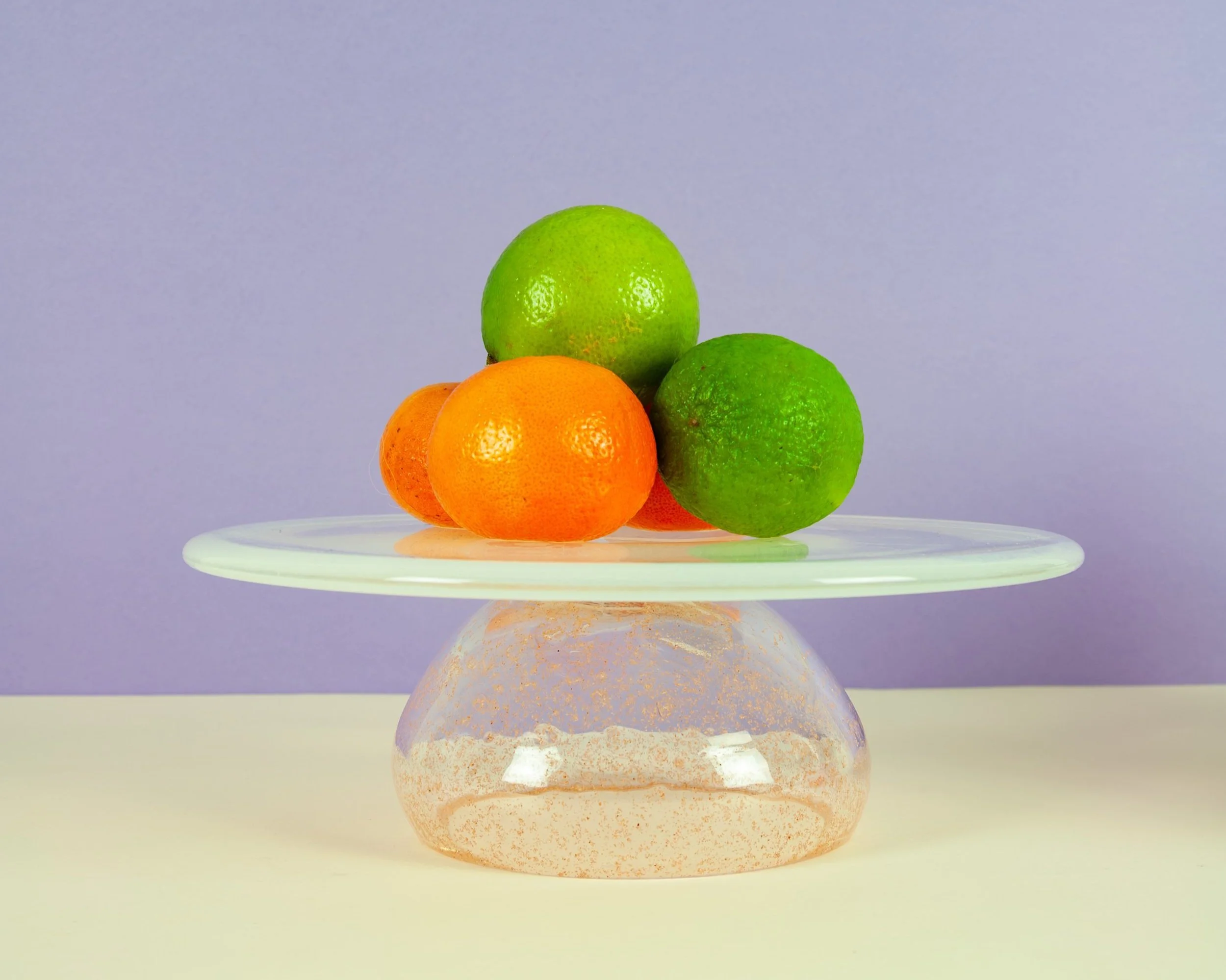 Cake stand in opaline white and desert sand in between two glass layers