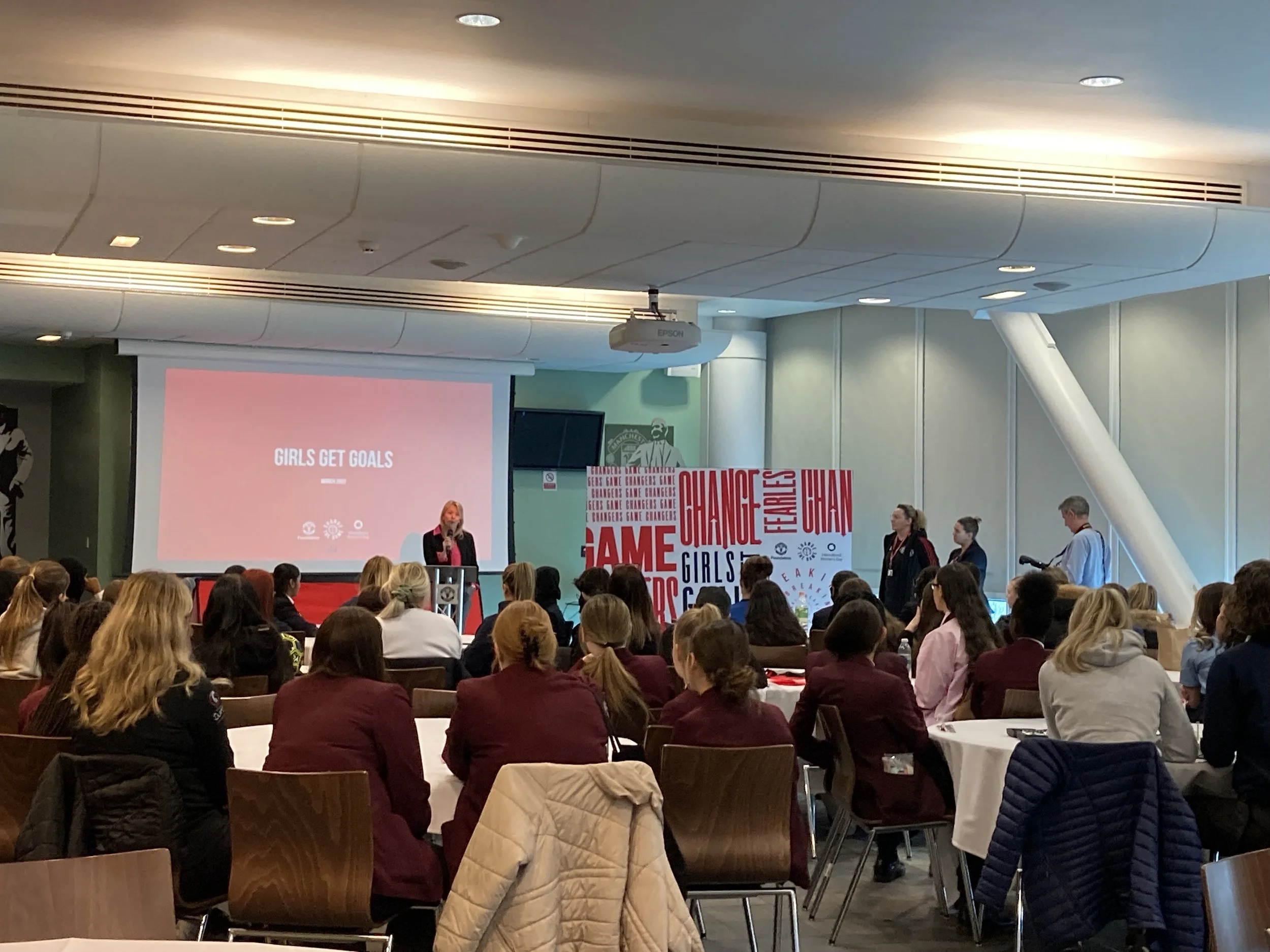Game Changers Event at Old Trafford with 15 Foundation schools attending. Groups seated look to the stage as speakers present