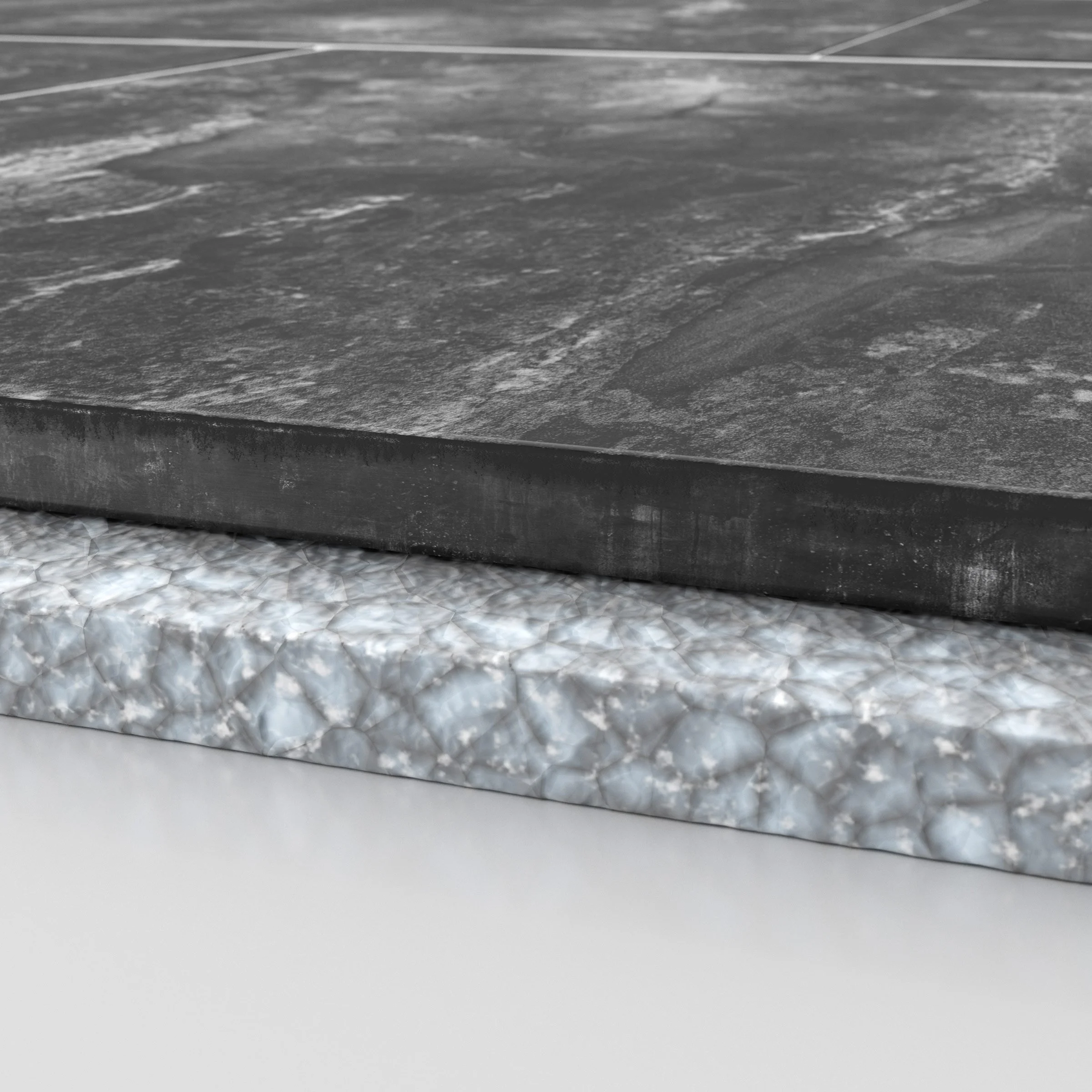 Close-up image of the layered edges of two different types of countertops, one dark and rough-textured and the other light with a marble pattern.