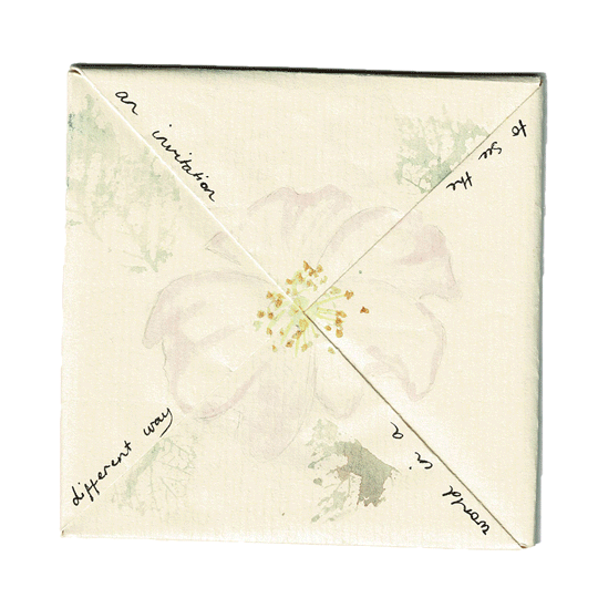 A white box with a floral design and diagonal handwritten text that reads: 'To all the women in a quarantine, different way.'