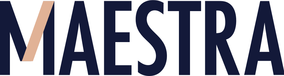 Close-up of the word 'Maestra' printed in bold black letters on a white background with a stylized letter 'V' in beige and pink shades.