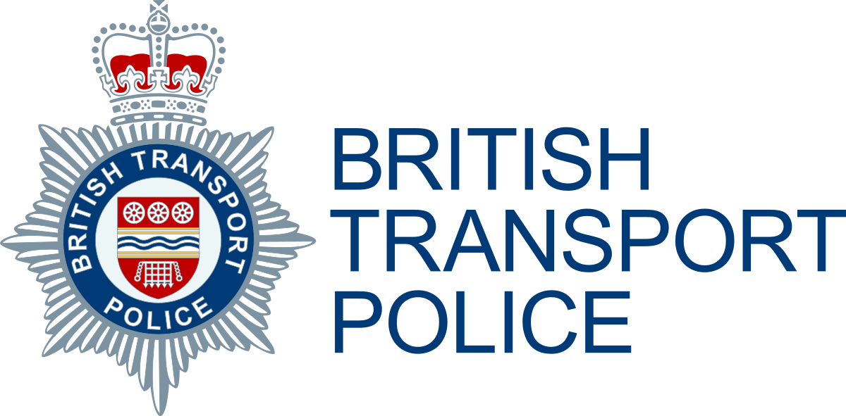 The logo of the British Transport Police, featuring a silver star-shaped badge with a red, white, and blue crest at the center, topped by a crown, and the text 'British Transport Police' to the right.