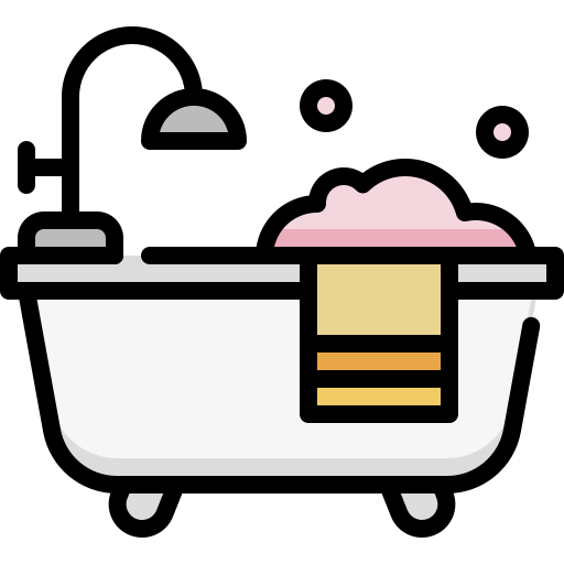 Bubble bath with foam, a rubber duck, and a showerhead.