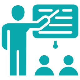 A person giving a presentation to two seated people in front of a blackboard.