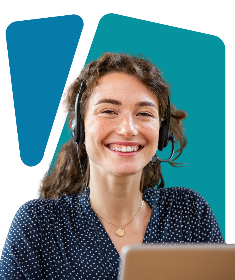 A woman wearing a headset with a microphone, smiling at a computer, against a colorful abstract background.