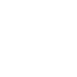 Two people sitting across from each other at a table, engaged in a conversation, with a speech bubble above them.