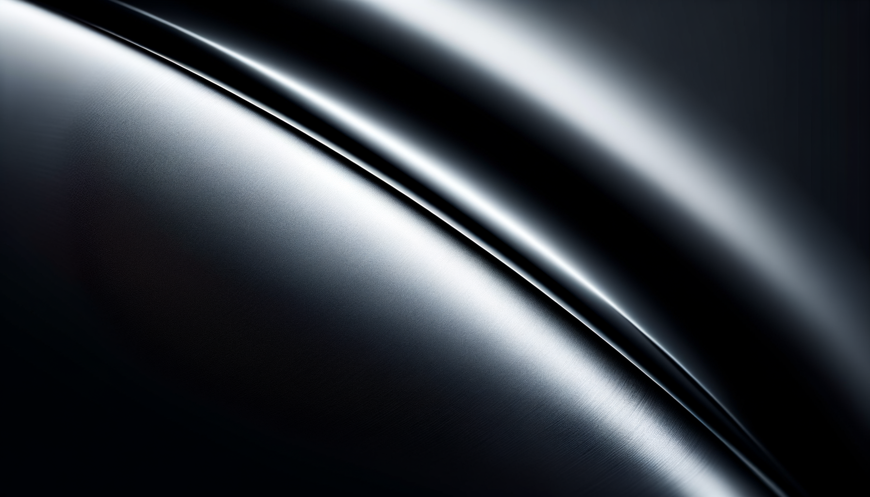Close-up of a sleek, shiny black surface with smooth curves and reflective highlights, possibly part of a modern electronic device or automobile.