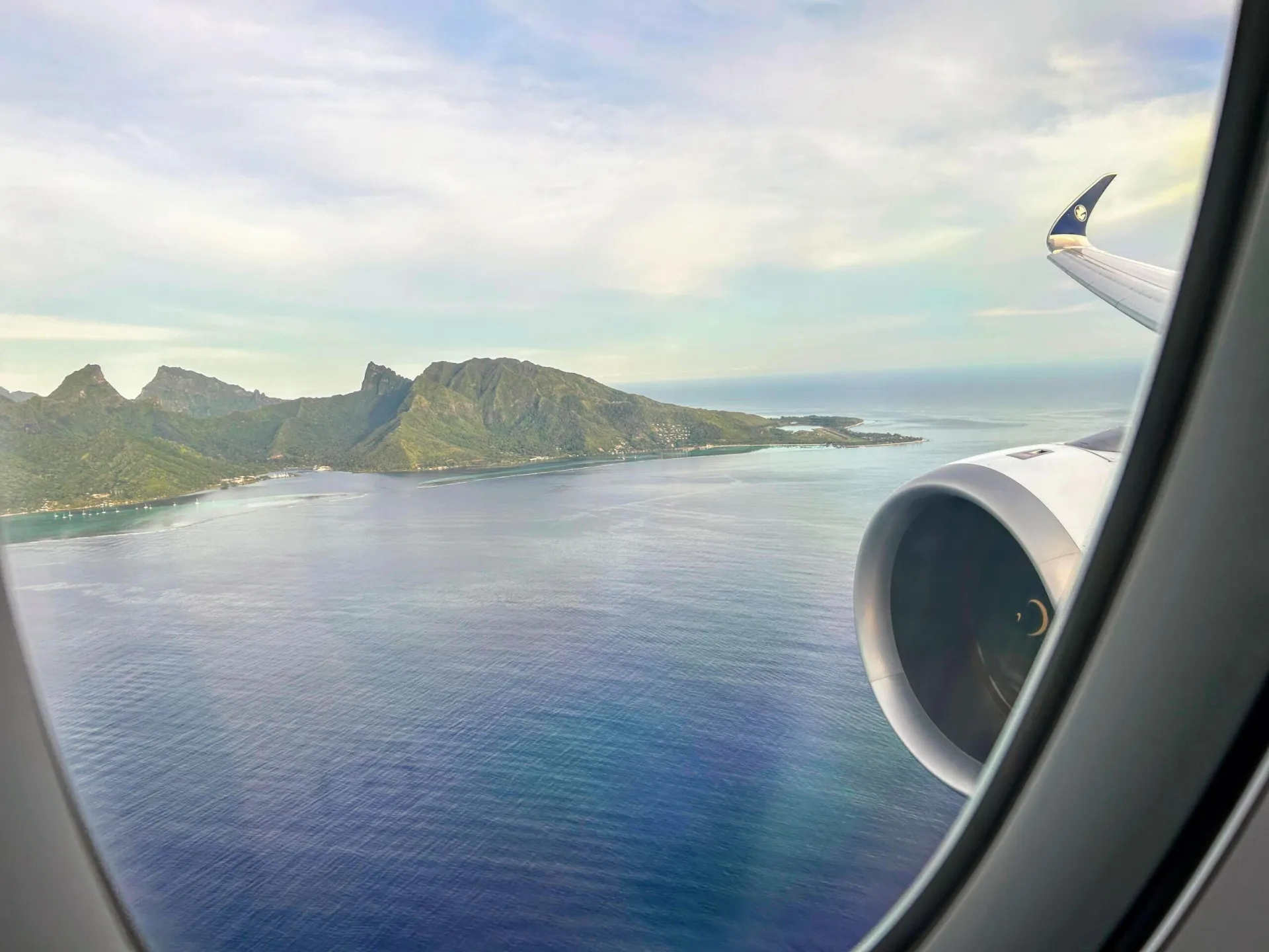 An Air France A350 landing with the mountains of Tahiti in the background
