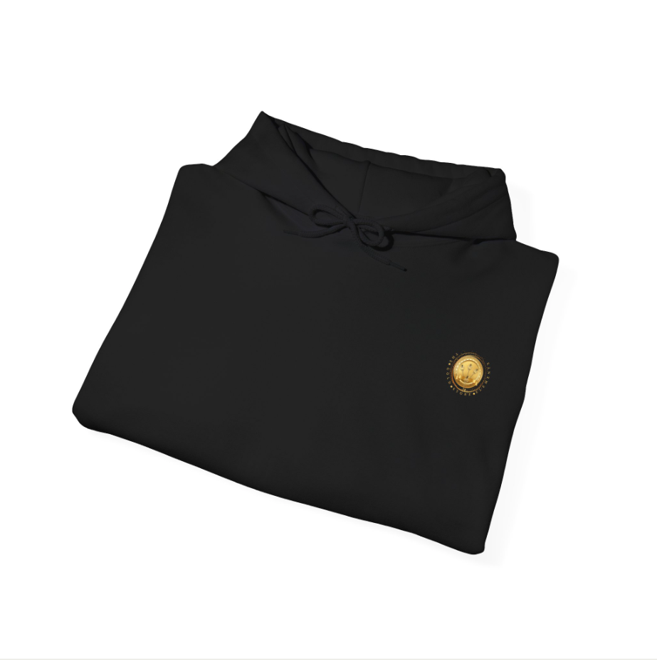 Black hoodie with a small gold emblem on the front, folded neatly.