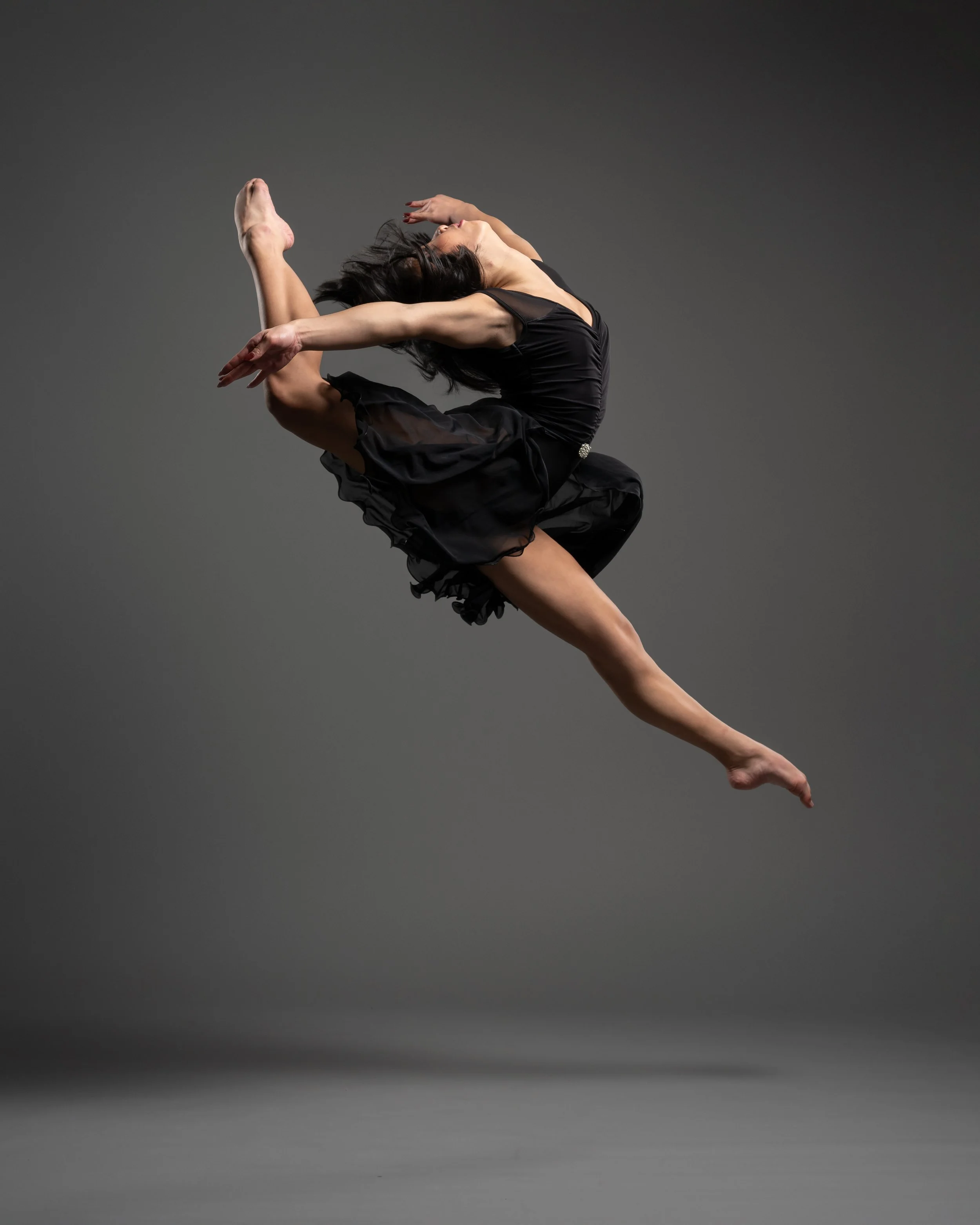 dancer in a firebird leap