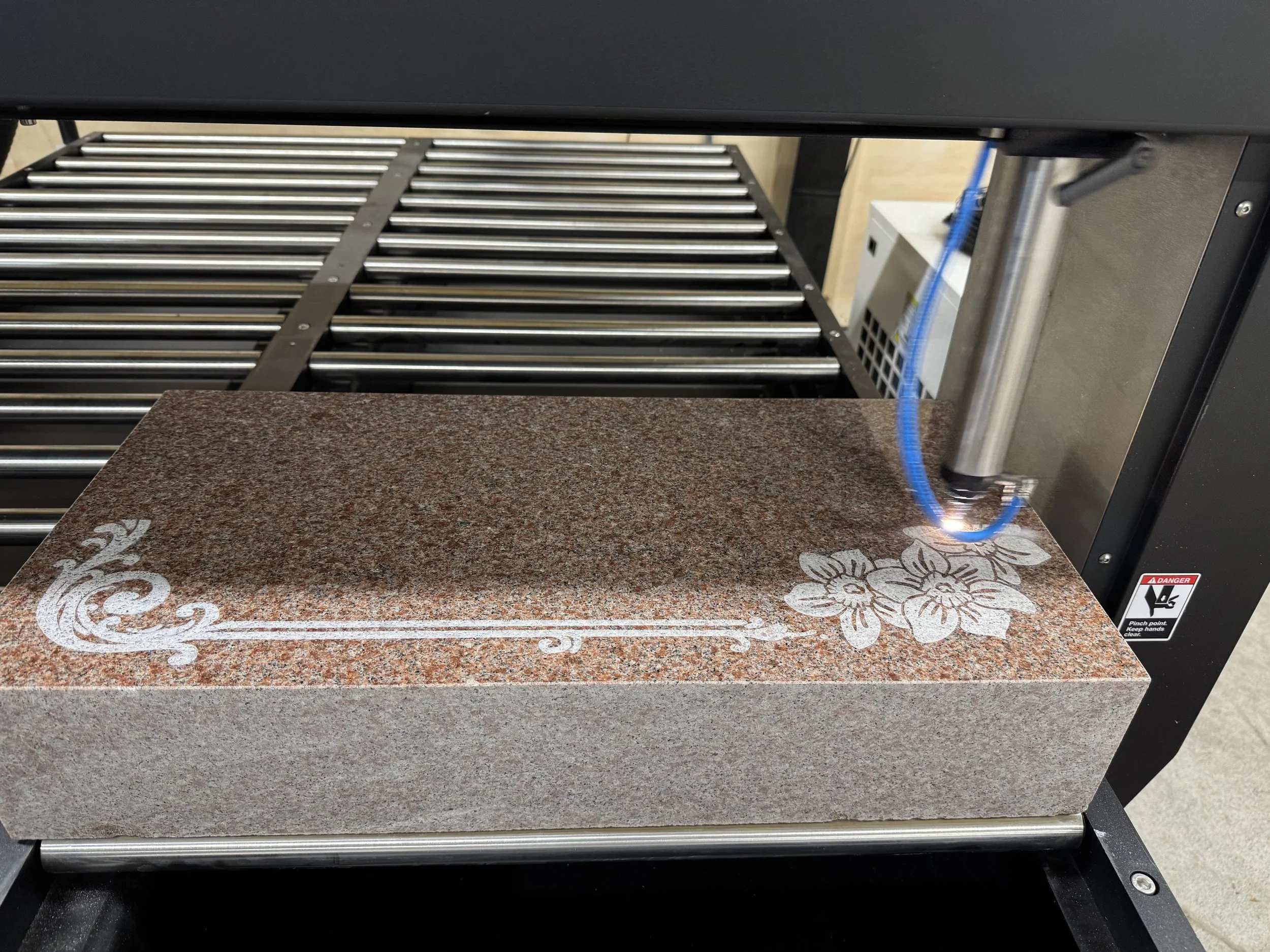 Using precision laser engraving technology in our Missouri Valley shop to create detailed images, landscapes, and personalized designs that tell a life's unique story