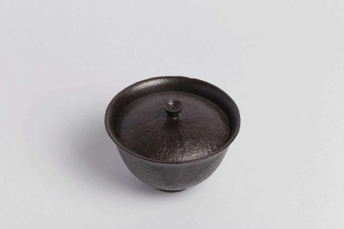 Gaiwan Metallic Black

Hand thrown in black stoneware clay, glazed and twice fired. Its minimalist form carries traditional sensibilities with fine detailing and a lightness of weight. Designed for steeping and sipping tea, allowing full control over