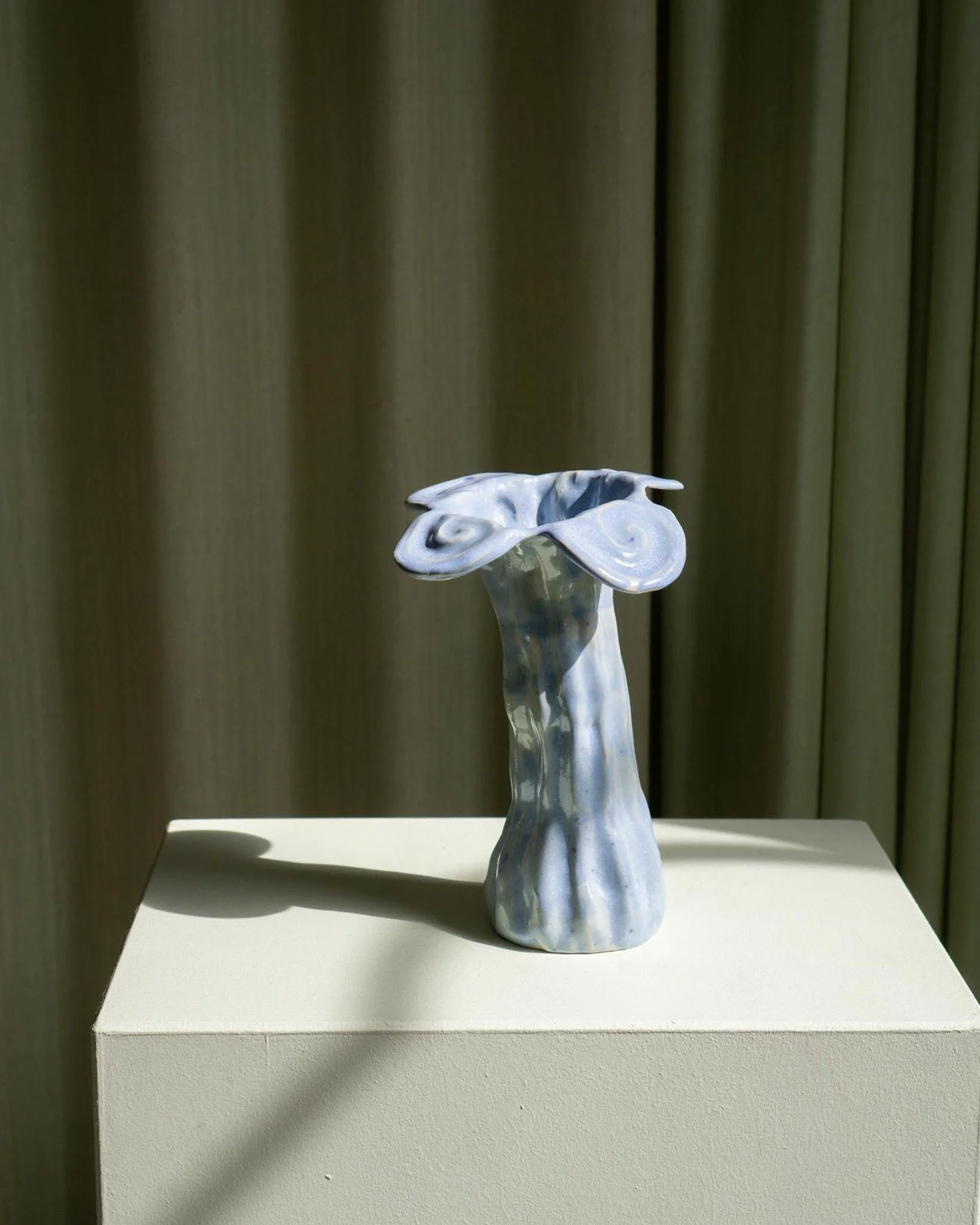 Beautiful Blue Flower Vase, part of our selection of ceramic pieces created by Charlotta Munsterhjelm. Available now at craftersoftoday.com. 

Hand built in stoneware in Helsinki and finished in a gentle baby blue glaze. Its fluid shape and subtle mo