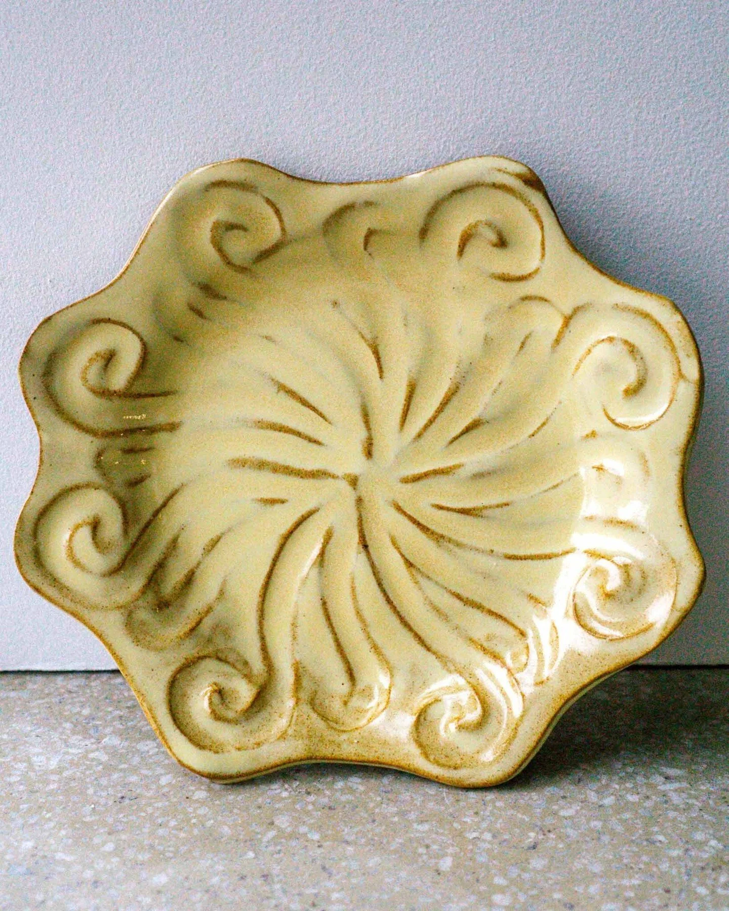 Stoneware Yellow Plate

Hand built in stoneware, the Stoneware Yellow Plate is finished with a clear, food safe glaze that highlights its soft butter yellow surface. Its gentle curves and warm tone echo Charlotta Munsterhjelm&rsquo;s playful approach